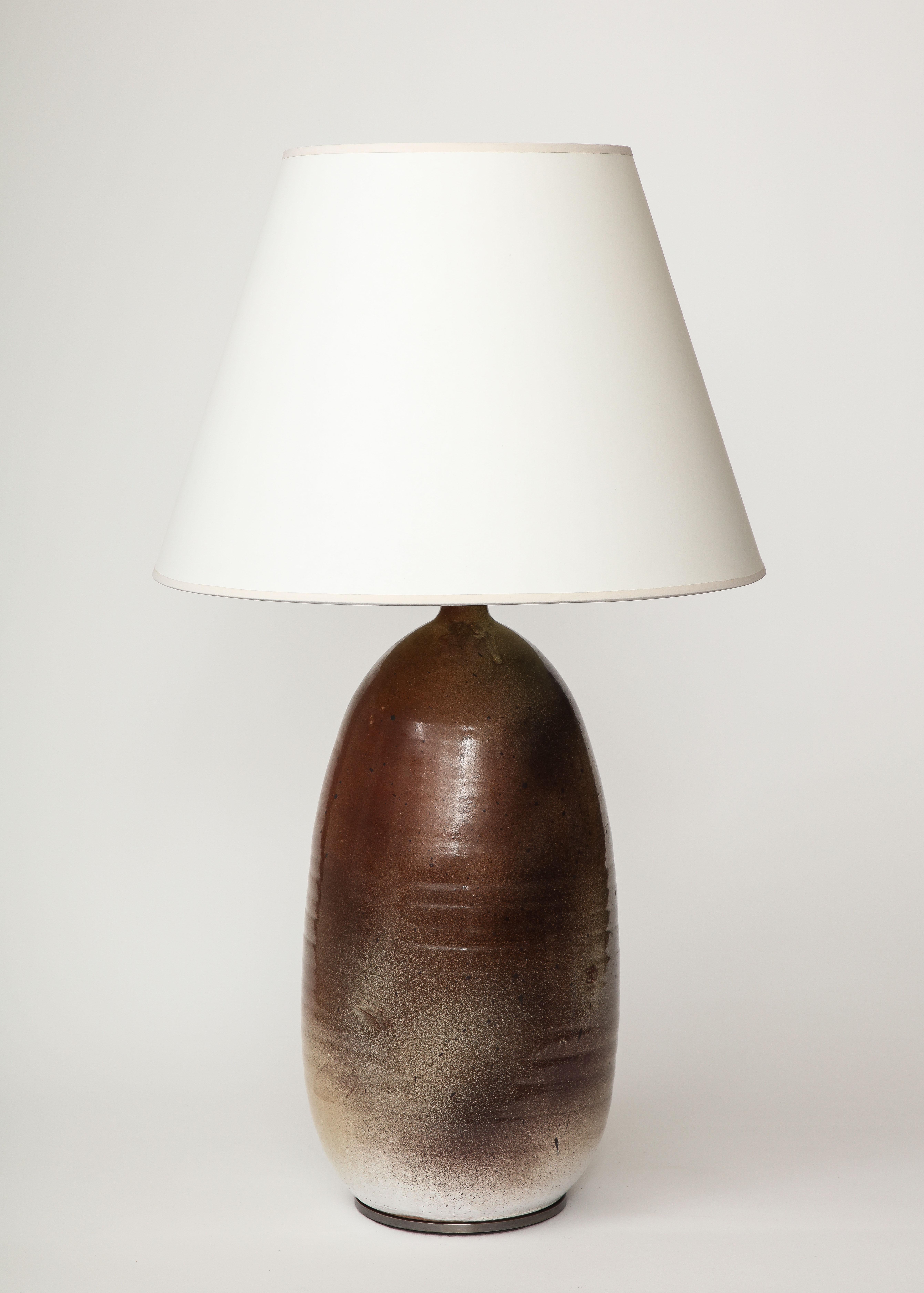 Tall, handsome table lamp with beautiful glazing. This table lamp was produced by the celebrated French ceramic studio Keramos. 

Keramos was founded by a group of ceramicists in 1948. The studio included artists such as Georges Jouve, Roger Capron,