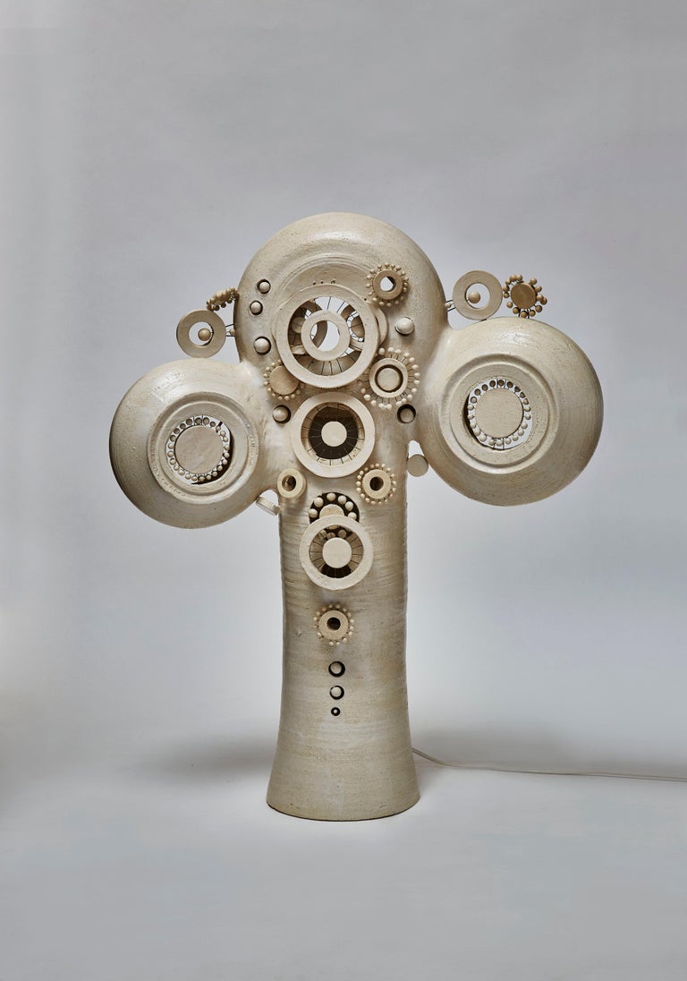 Glazed ceramic tall TOTEM table lamp by the artist Georges Pelletier from the south of France.

Four light sources hidden inside giving an indirect light through the decors.
