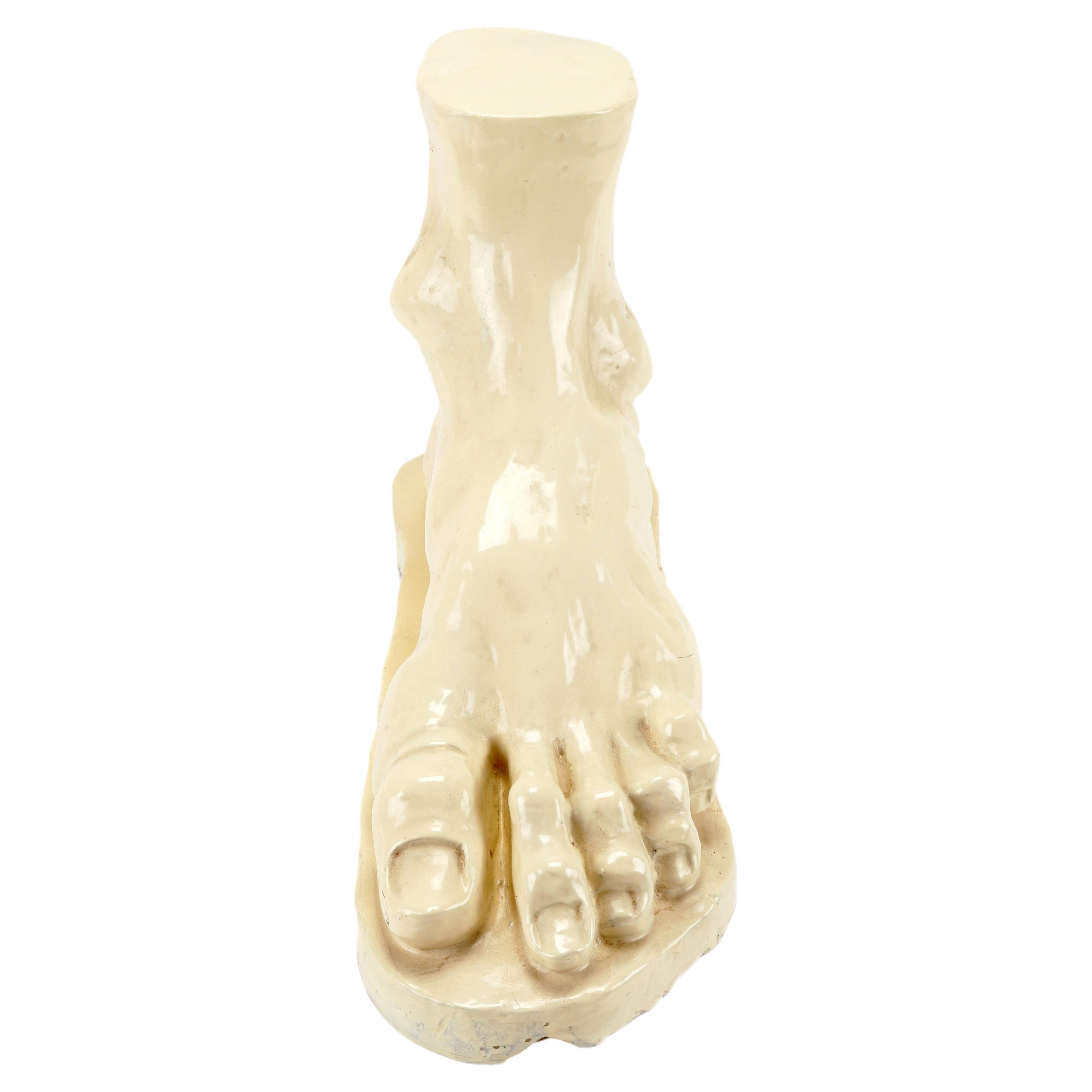 Glazed clay sculpture depicting a foot, Italy 1900.