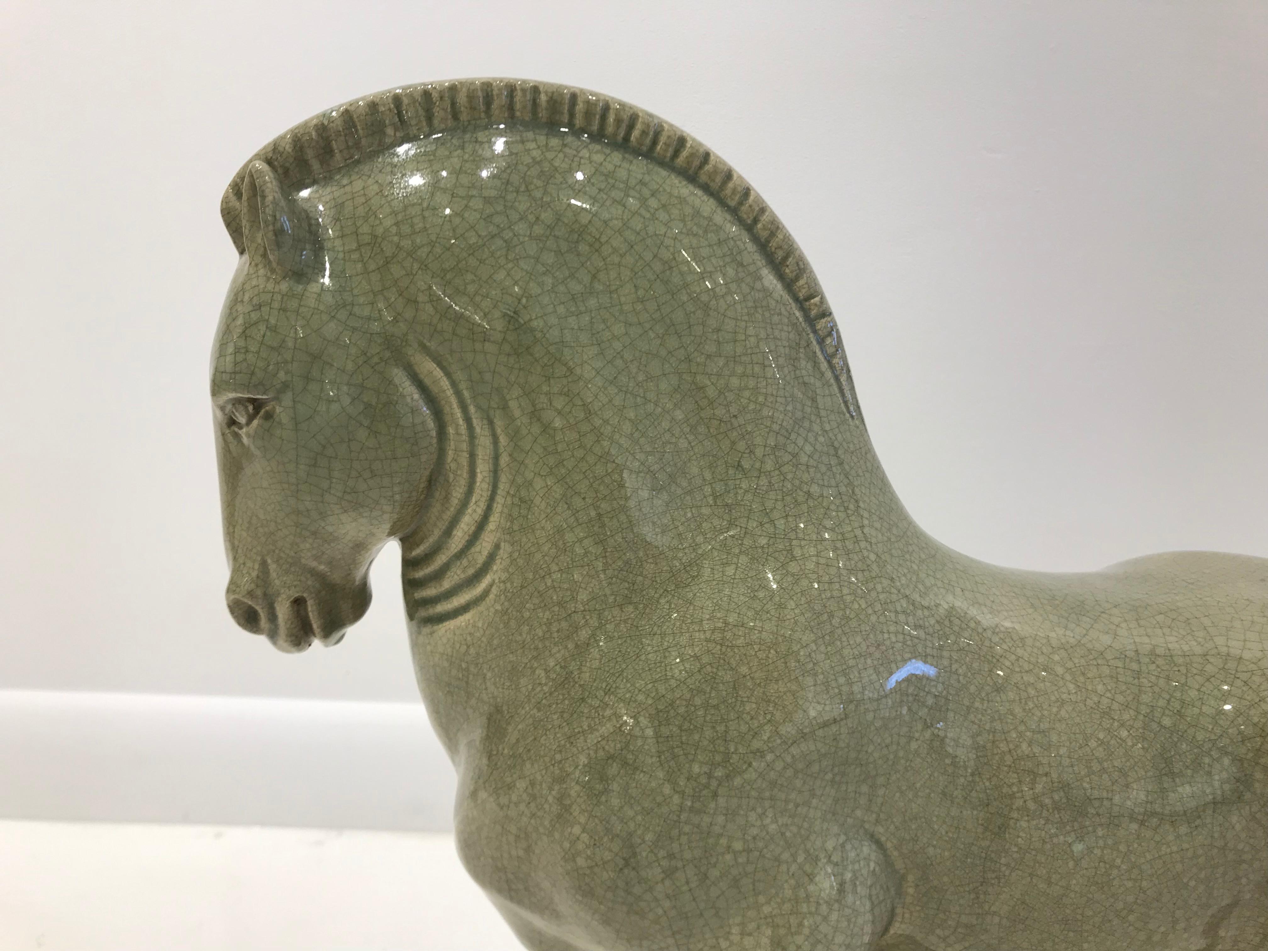 Glazed crackled ceramic celadon horse sculpture. Marked under the base 