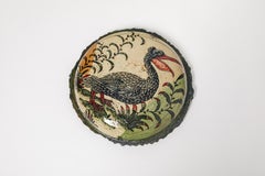 Glazed earthenware medaillon, with fantastical animals by Jérôme Galvin.