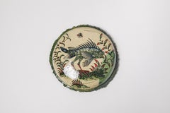 Glazed earthenware medaillon, with fantastical animals by Jérôme Galvin.