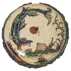 Glazed earthenware medaillon, with fantastical animals by Jérôme Galvin.