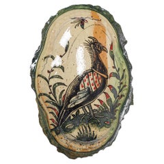Glazed earthenware medaillon, with fantastical animals by Jérôme Galvin.