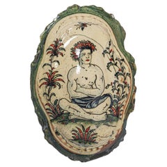 Glazed earthenware medaillon, with fantastical animals by Jérôme Galvin.