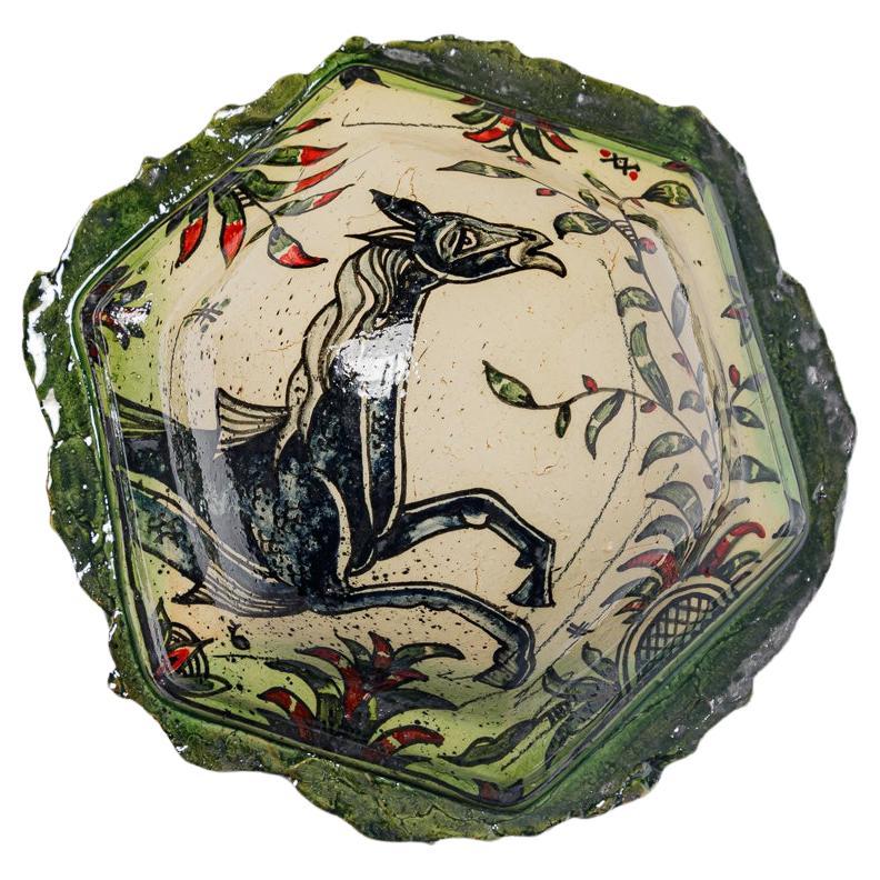 Glazed earthenware medaillon, with fantastical animals by Jérôme Galvin.