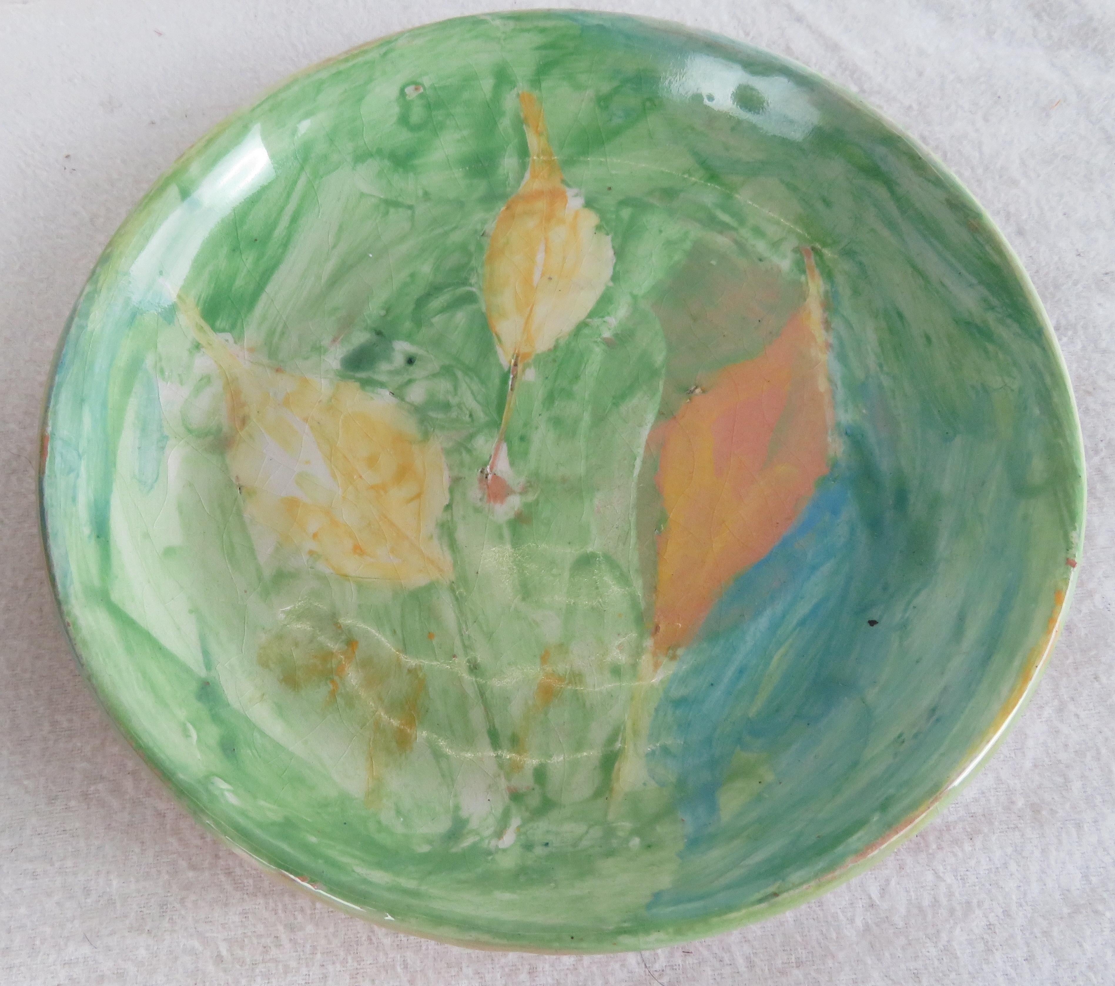 Glazed Earthenware plate by British Ceramicist Ann Stokes (1922-2014), incised artist's signature on back 