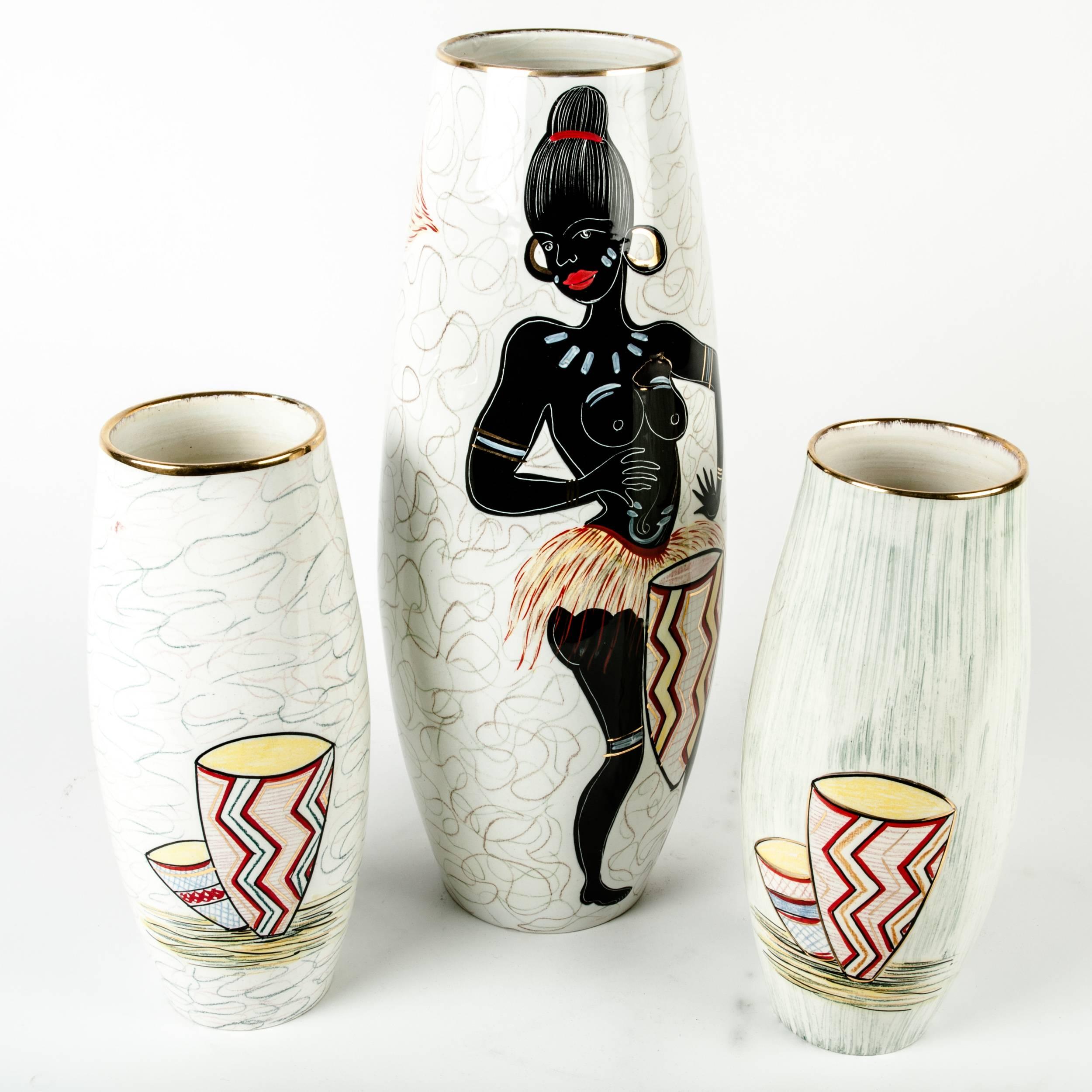 Mid-20th century glazed porcelain Italian set limited edition decorative vases or pieces with tribal exterior design details. Each vase is in great vintage condition with minor wear, maker's mark undersigned. The taller vase stand about 16