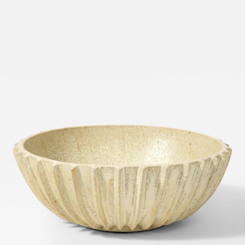 Glazed Stoneware Bowl by Arne Bang, Denmark, c. 1930

This modern, geometric bowl is a beautiful example of Arne Bang's design sensibility and glazing expertise. The contrast between the creamy white and brown-beige glazes is entrancing.