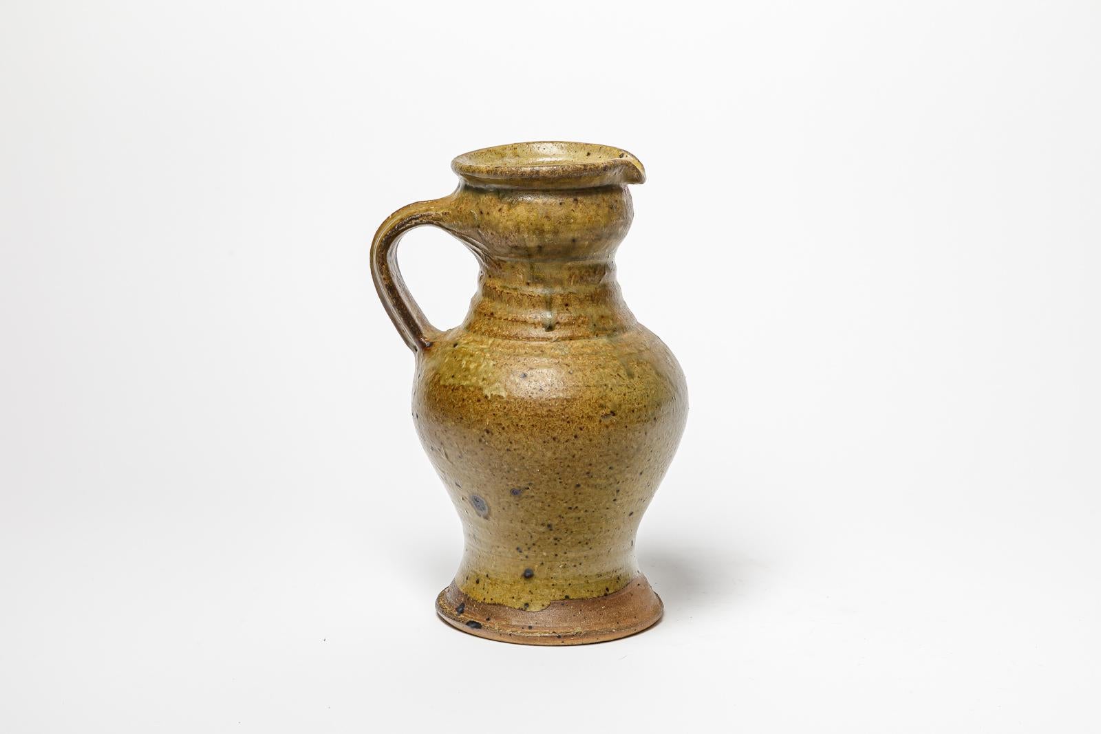 Glazed stoneware pitcher by Pierre Digan.
Artist monogram under the base. Circa 1970-1980. 
H : 11.8’ x 7.5’ x 6.3’ inches.