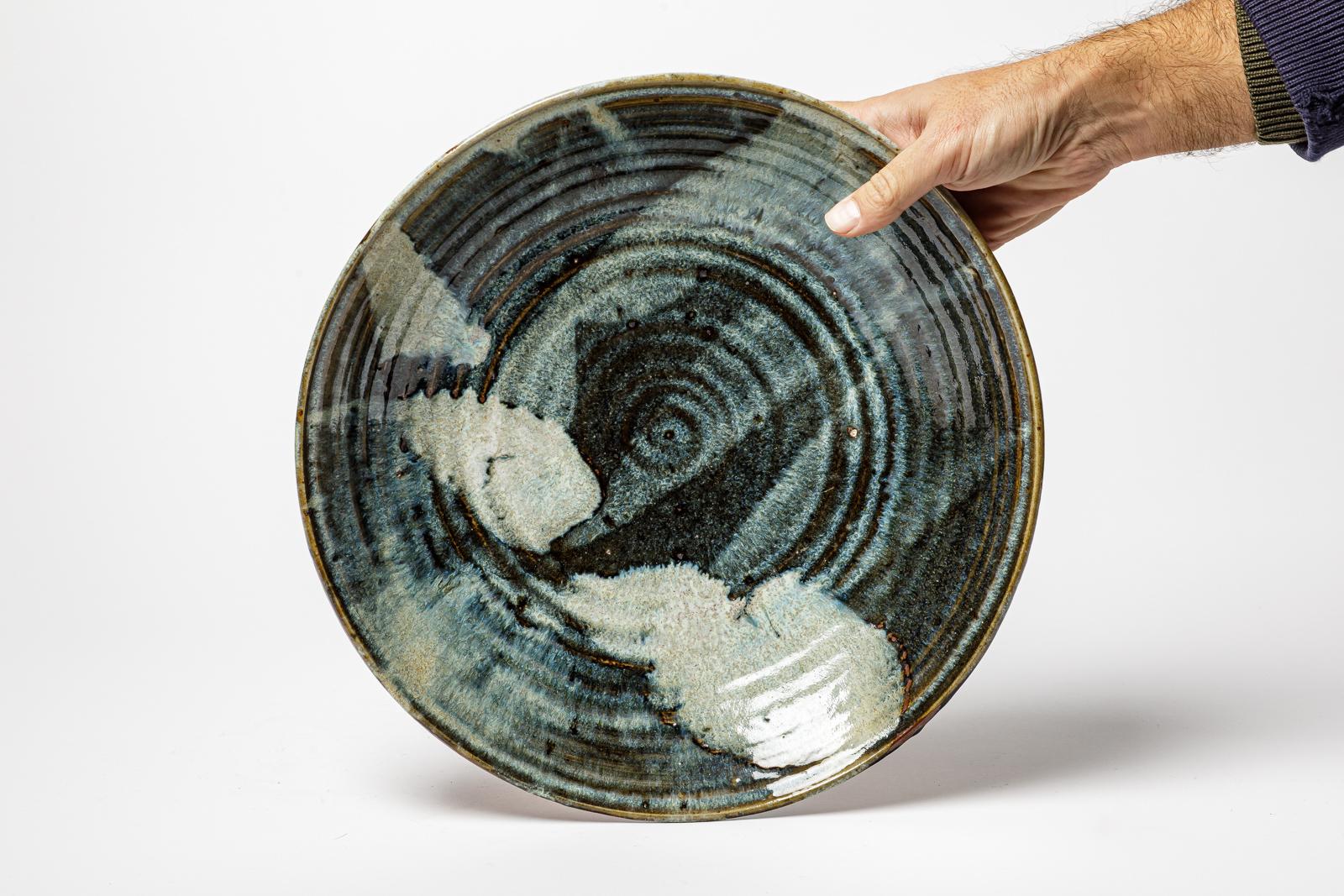 French Glazed stoneware plate by Raoul Favretto, circa 1980-1990. For Sale