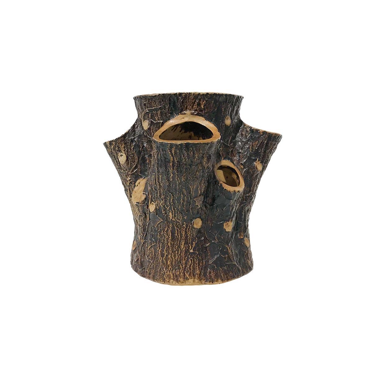 19th century glazed molded stoneware planter of tree stump form. Molded with bark surface and cut branches forming 5 small openings in addition to the large central opening. Impressed F.B. Norton & Co., Worcester, Mass on the bottom. (Minor chips).