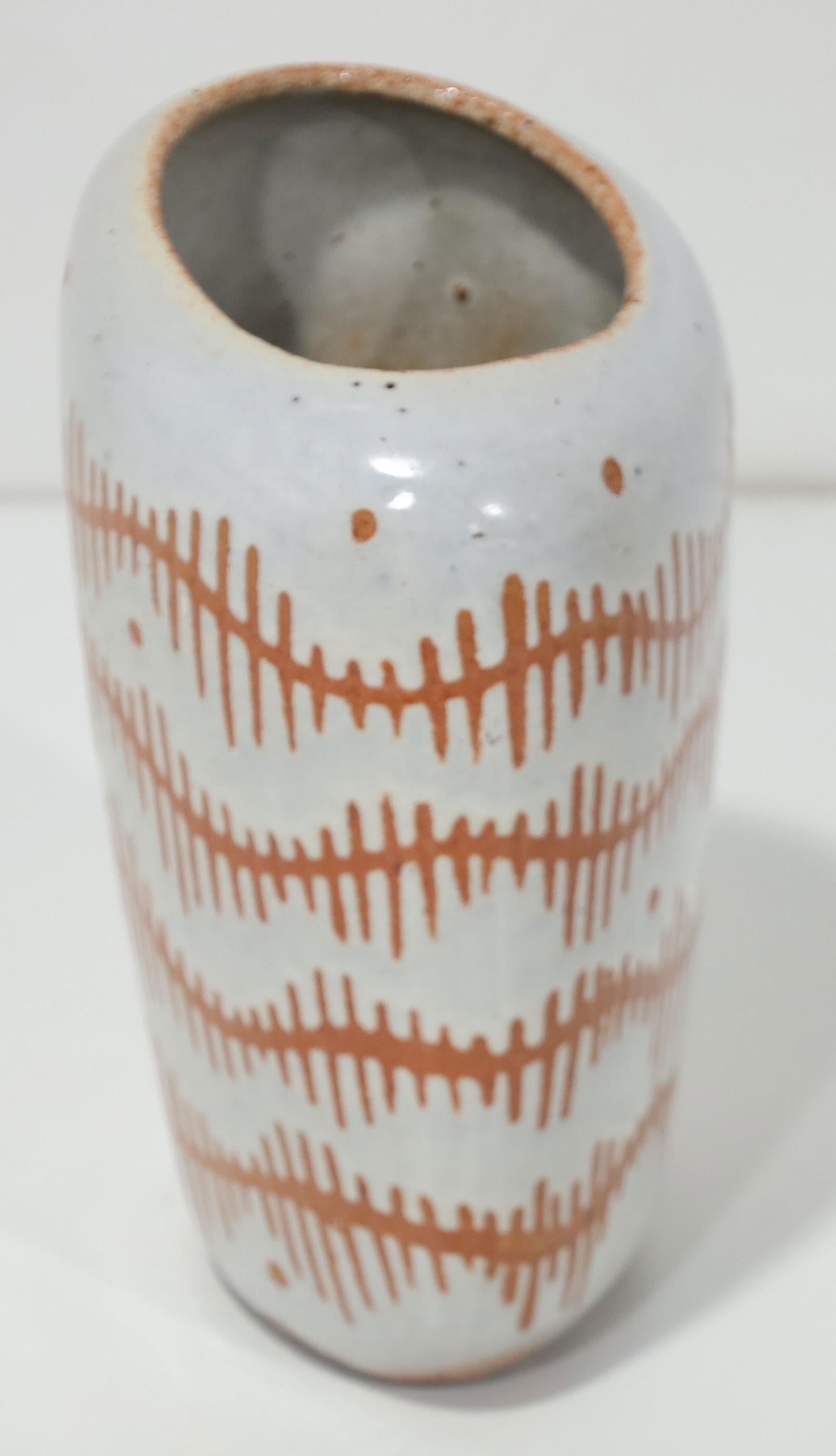 Beautiful pattern on medium sized stoneware vase. Asymmetrical shape with asymmetrical opening.  Circa 1960s. 