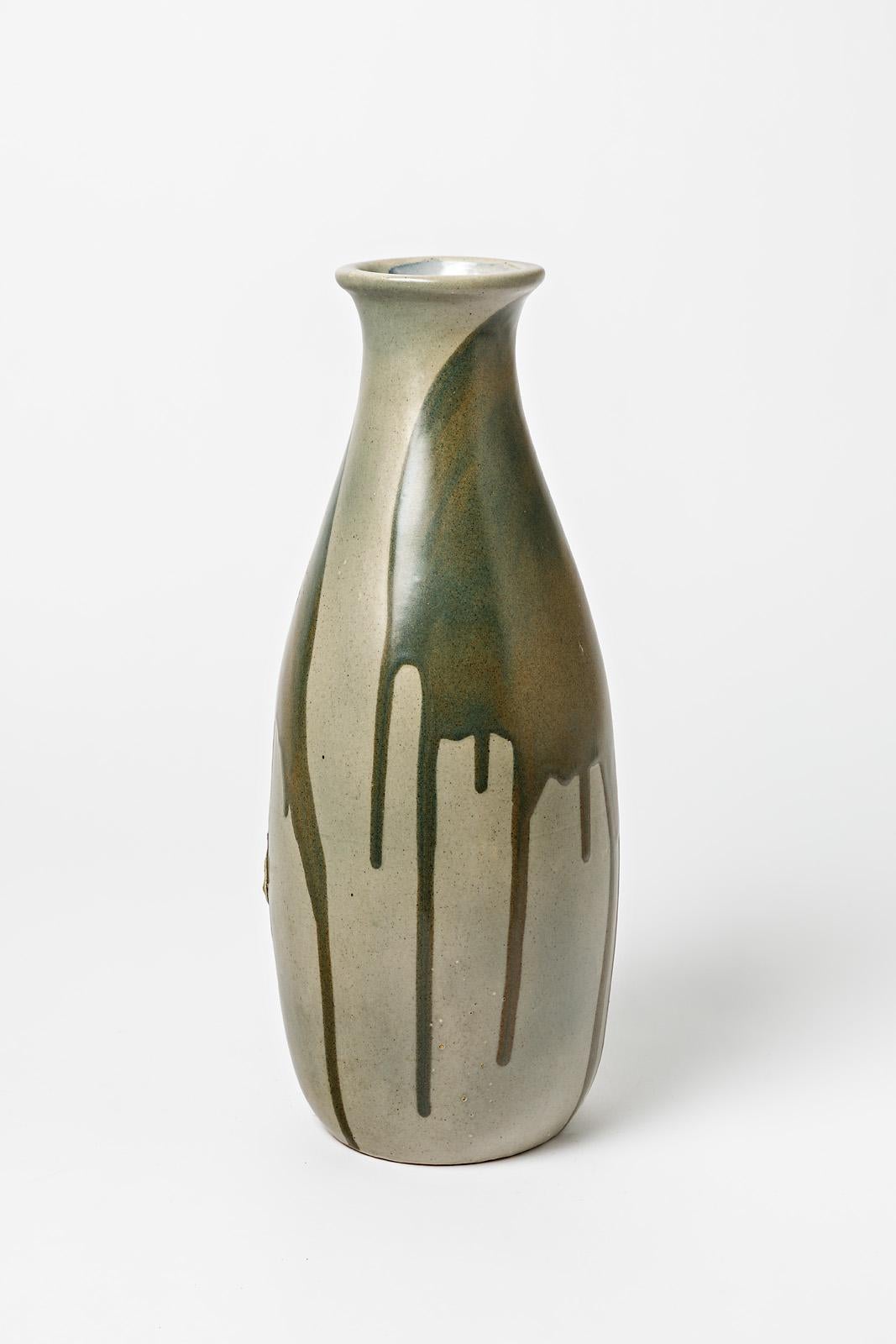 Glazed stoneware vase with dripping decoration by Jean Pointu.
Artist signature under the base « Pointu fils ». Circa 1950.

H : 16.1’ x 5.9’ inches.