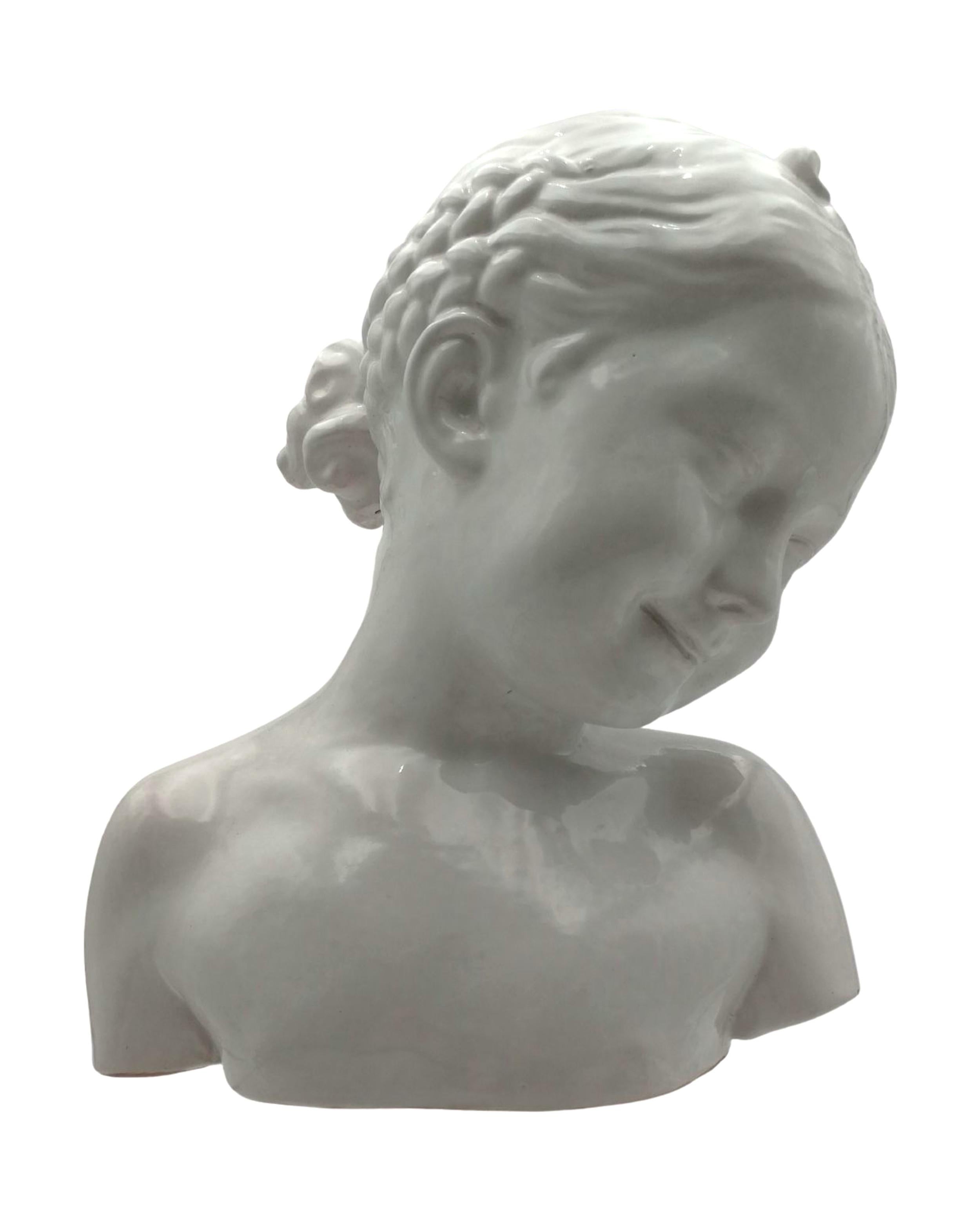 Lovely handmade glazed terracotta bust of a little girl. The amazingly sweet smile of this infant gril will catch your eye and bring peaceful sweetness to any room in a house.
The bust was acquired in Spain in the 60’s, it is not signed and the