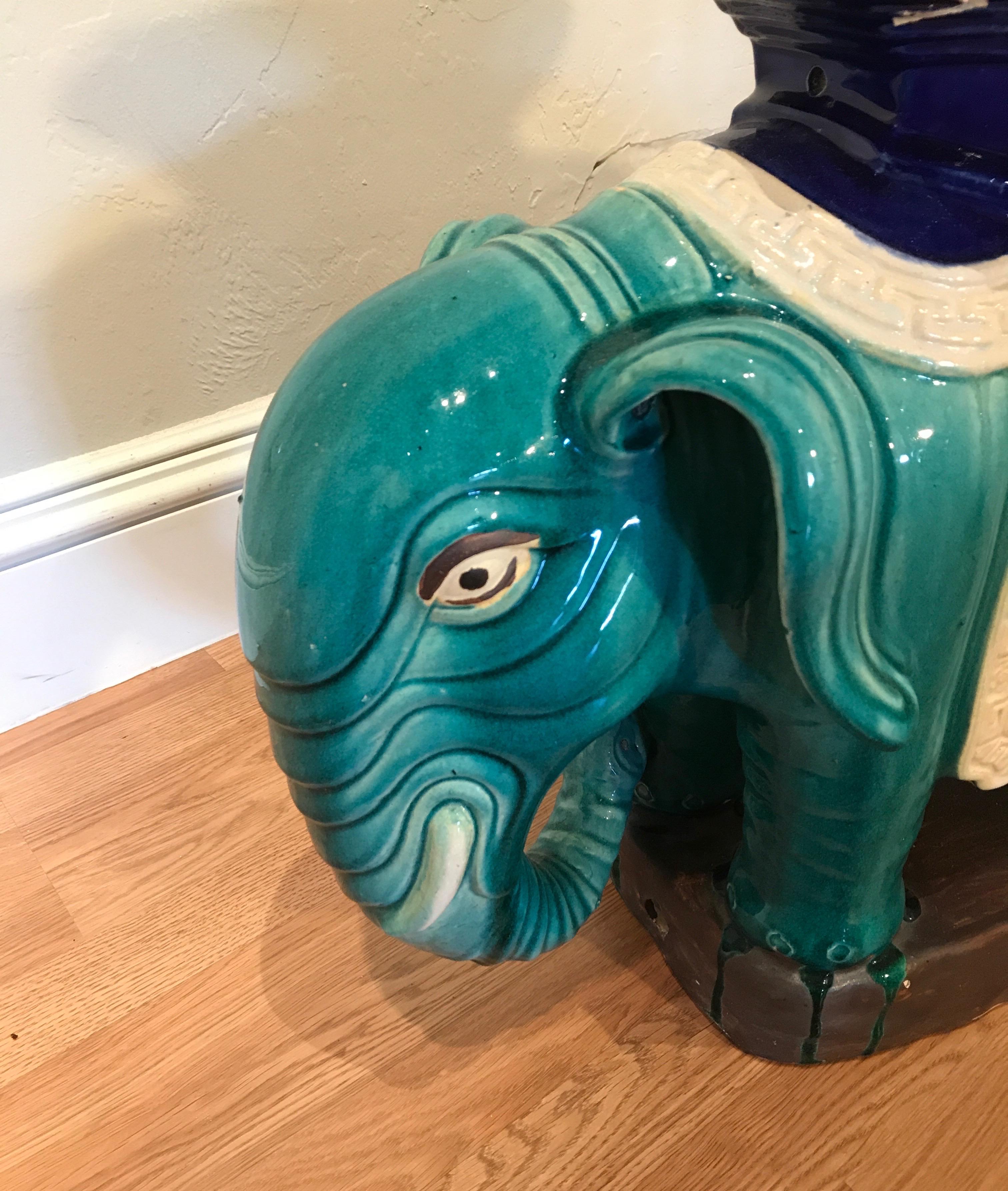 Charming glazed terracotta elephant garden seat in beautiful and vibrant shades of teal and royal navy blue.