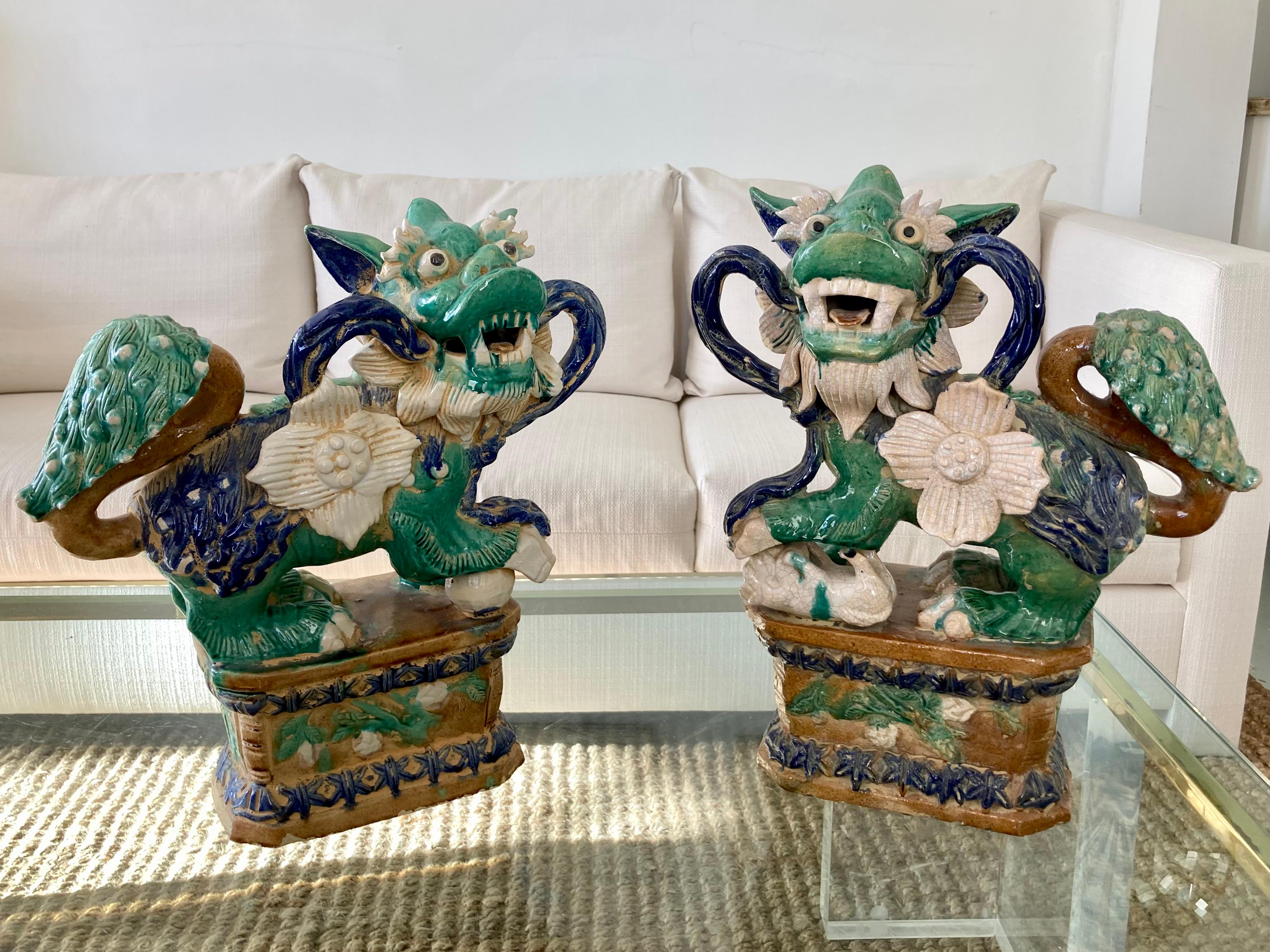 Beautiful pair Glazed Terra Cotta Foo Dogs. Gorgeous design, colors, and details. See our collection of foo dogs in our inventory.
