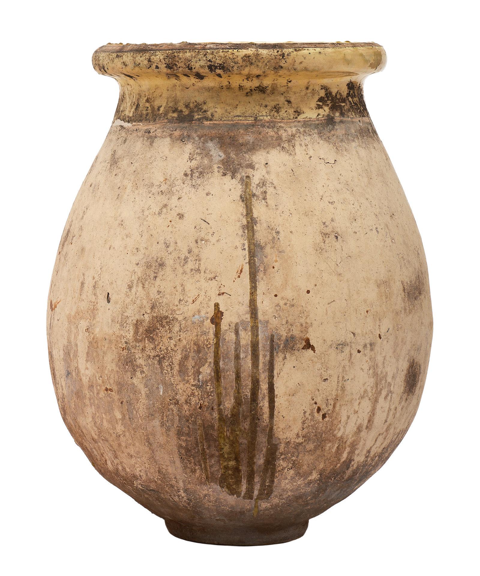 A 19th century antique glazed terra cotta urn from Biot, France. We love the character and patina on this beautiful and impressive jardinière.