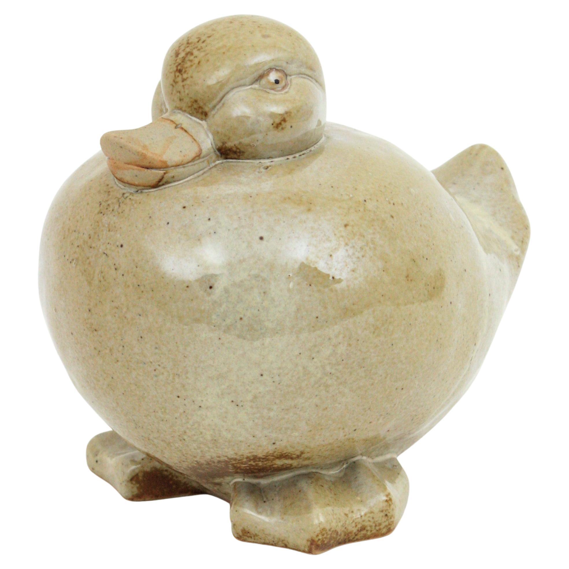 Scultura centrotavola di anatra in terracotta smaltata beige
