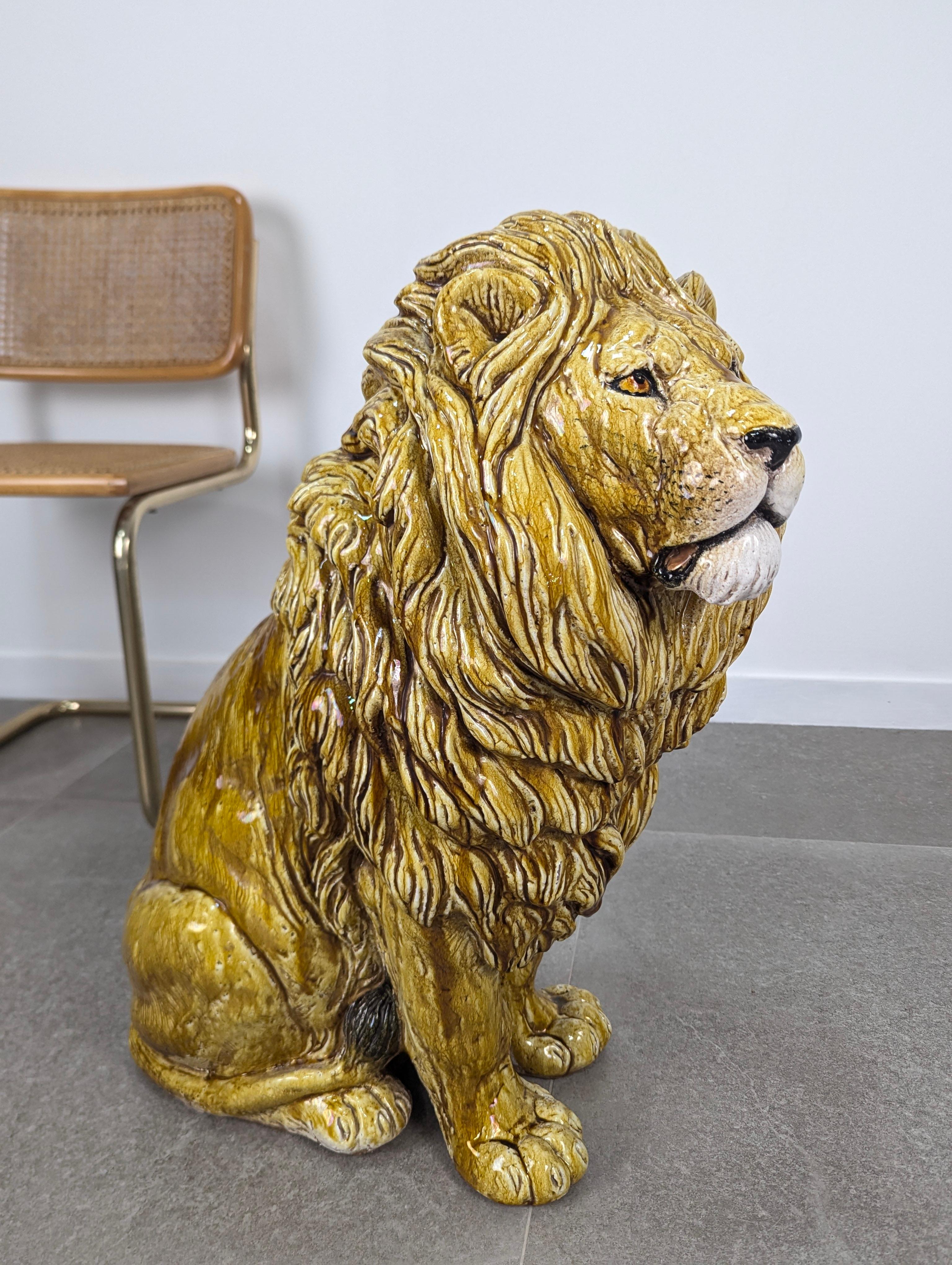Majestic glazed terracotta lion, originating from Italy and dating back to the 1960s. This unique, handcrafted piece captures in great detail the strength and elegance of this magnificent feline. The glazed surface gives it a brilliant finish that