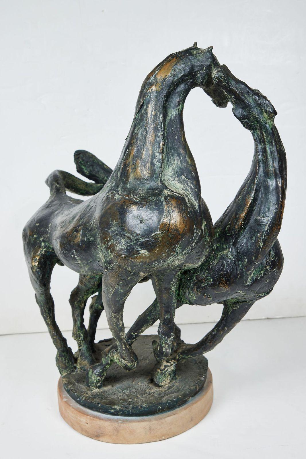 An initialed, vigorously modeled, patinated resin sculpture of two stallions at play signed (see image 5) by listed, Italian artist, Marino Mazzacurati (1900-1969).

Mazzacurati was a painter and sculptor who worked in Cubism, Expressionism and