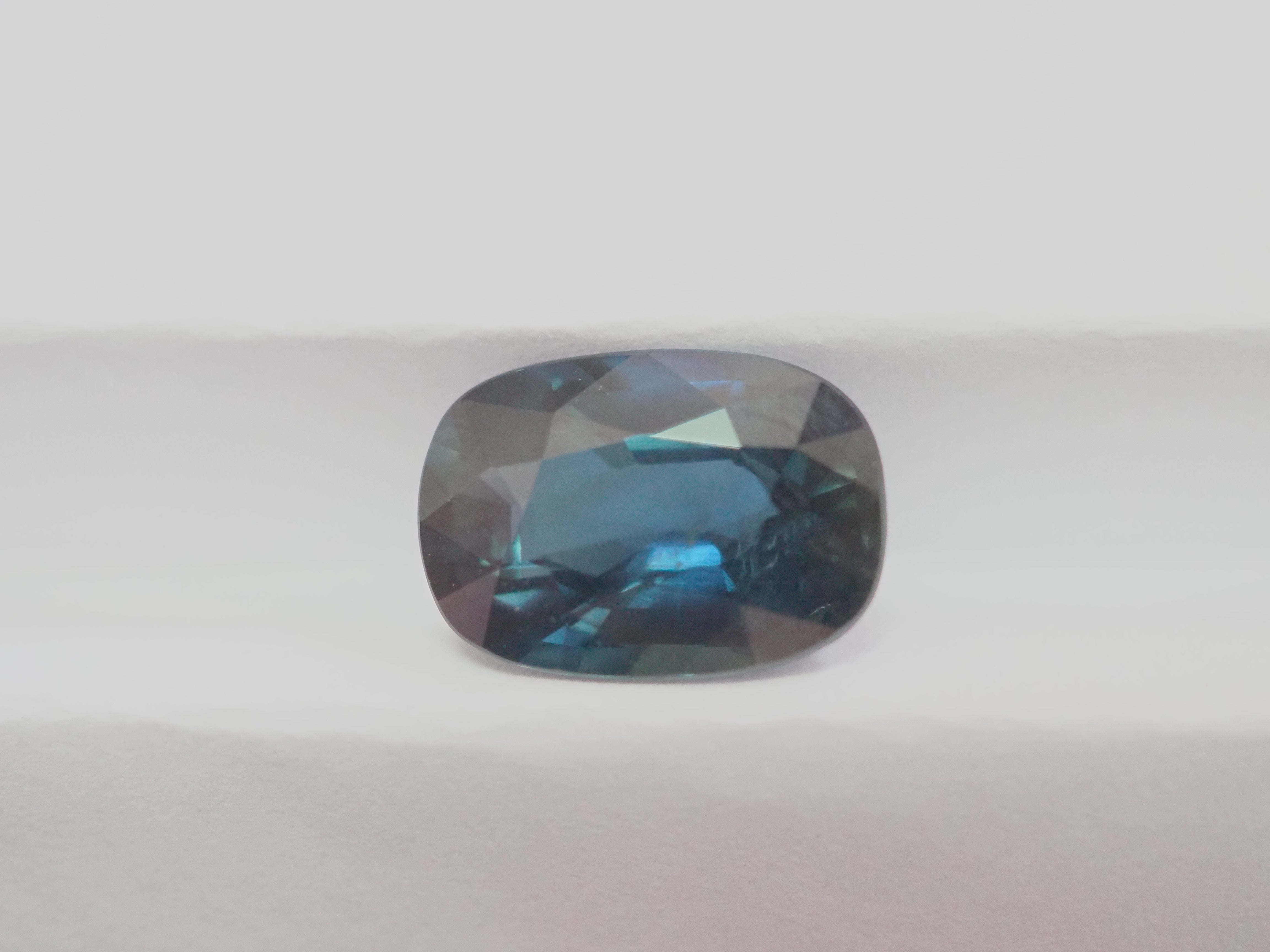 Sapphire fans please do not miss:
This particular Thai sapphire has a greenish blue color or can be called Teal color. The cut is a cushion cut and was polished in Thailand. Sparkling well in the sun with good saturation of color.

This gemstone has