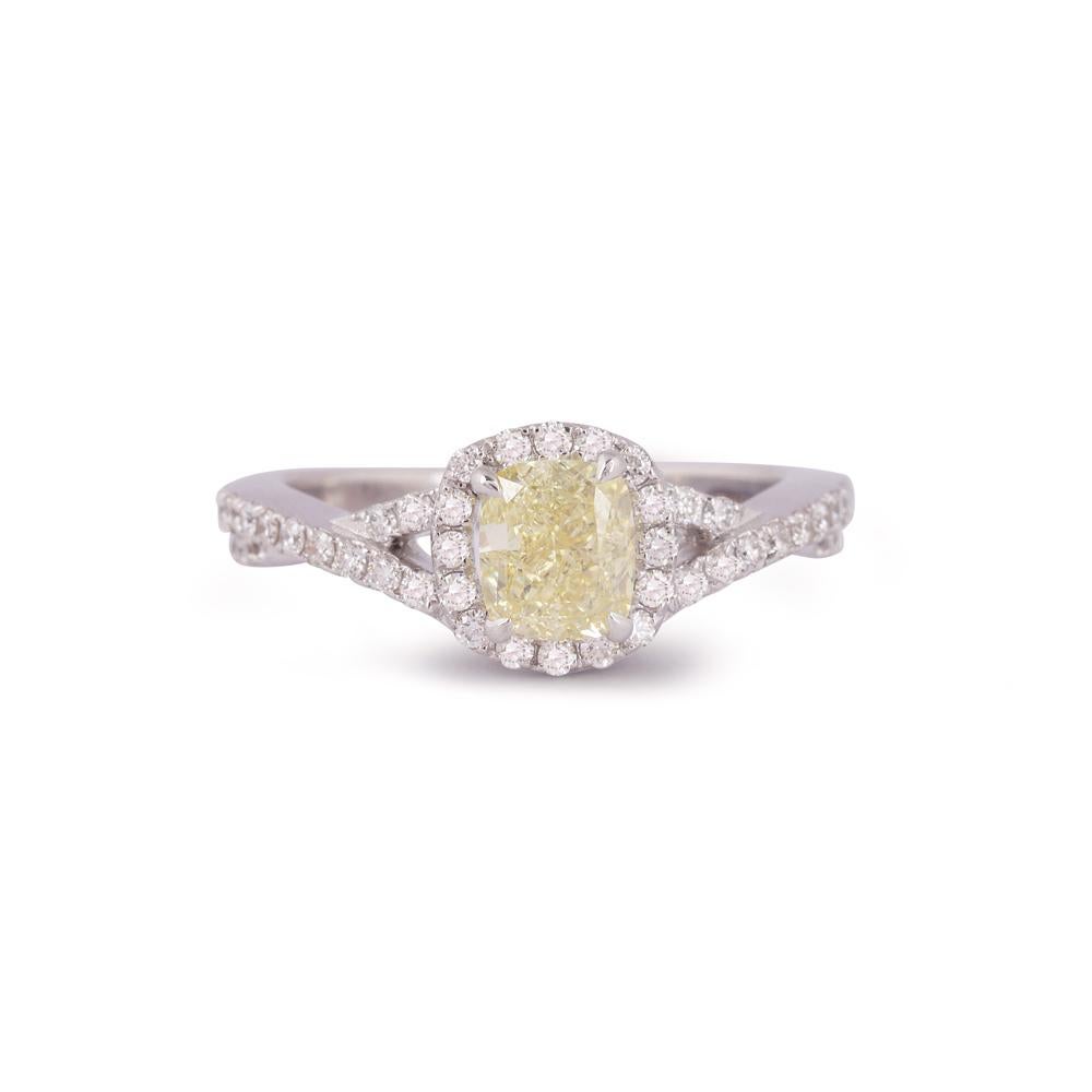 Crafted in 3.73 grams of 18-karat White Gold, The Ruckaro Ring contains 46 Stones of Round Diamonds with a total of 0.39-Carats in G-H Color and VVS-VS Clarity combined 1 Stone of Cushion Diamond with a total of 1.02-Carats in Fancy Yellow 