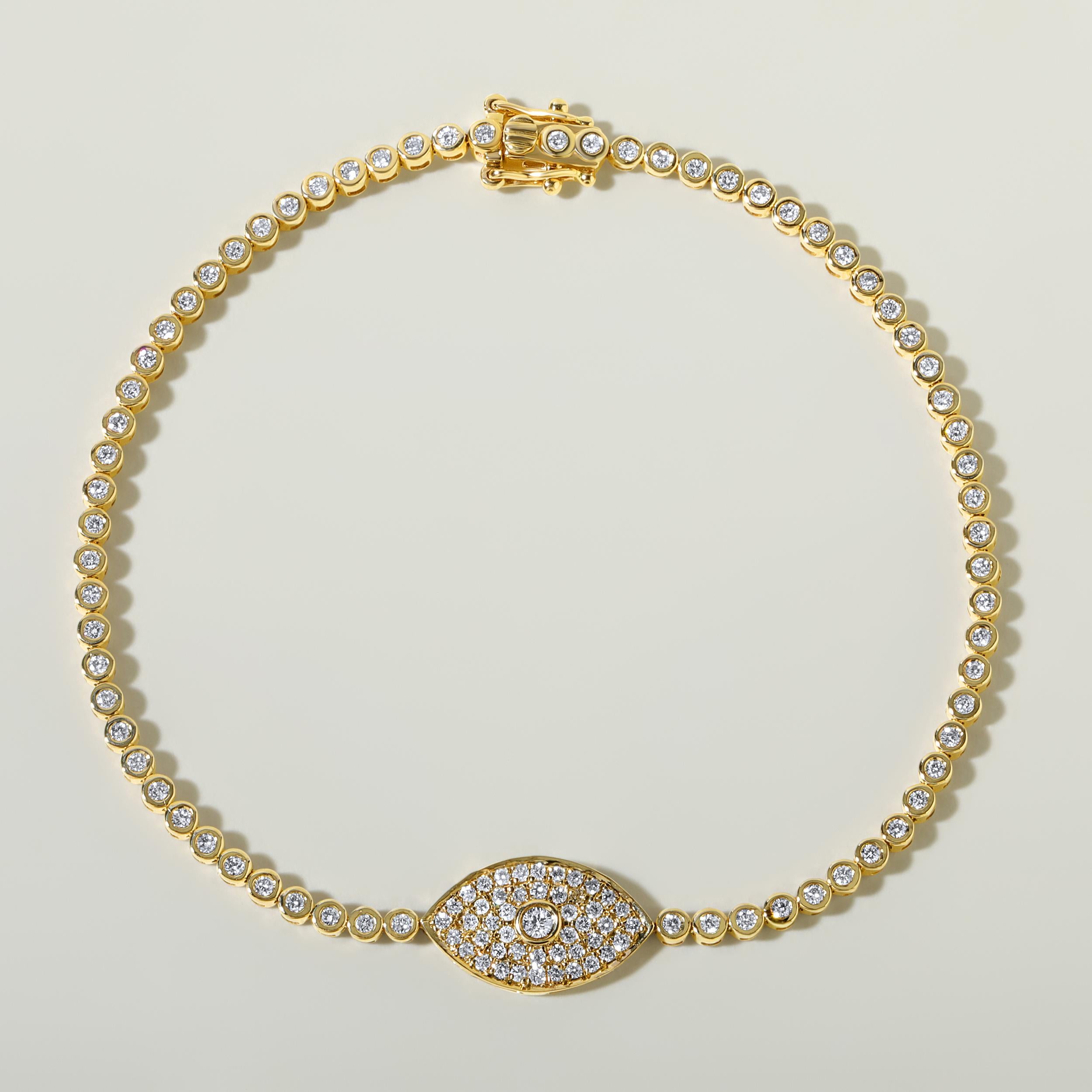 Crafted in 5.6 grams of 14K Yellow Gold, the bracelet contains 116 stones of Round Natural Diamonds with a total of 0.96 carat in E-F color and SI clarity. The bracelet length is 7 inches.

CONTEMPORARY AND TIMELESS ESSENCE: Crafted in