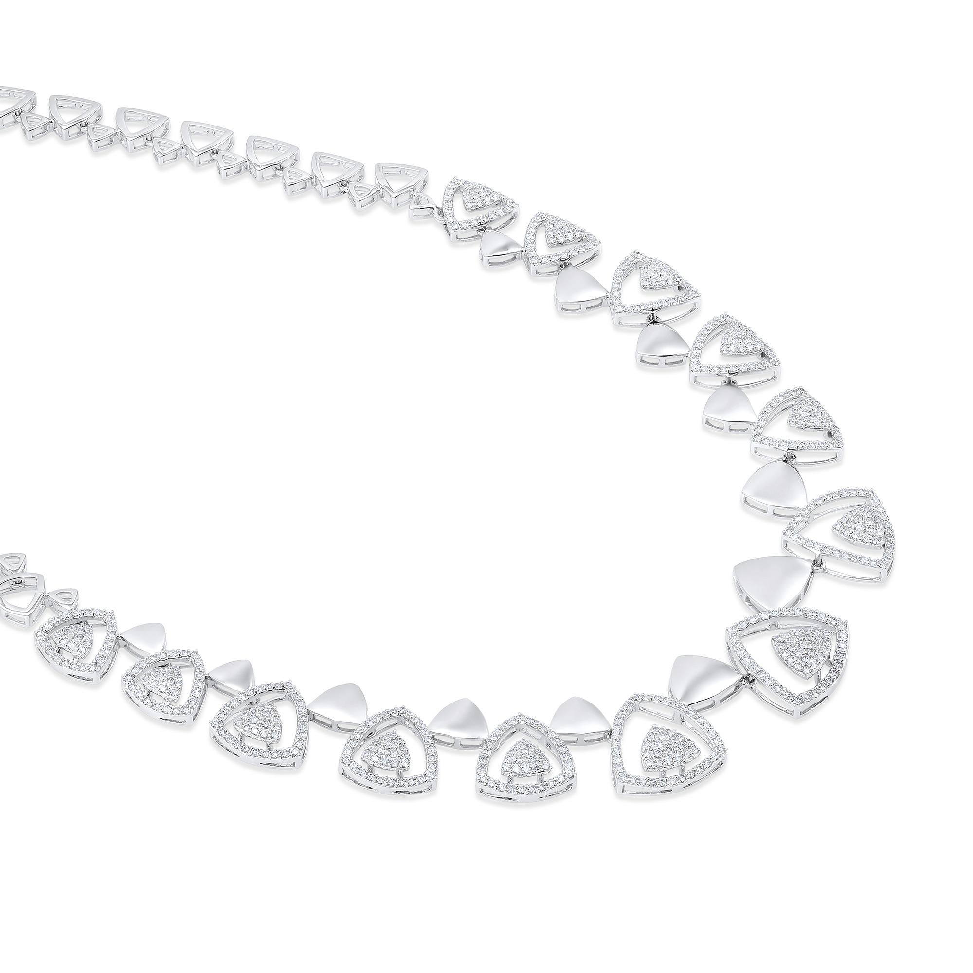 Crafted in 31.78 grams of 14-karat White Gold, contains 713 Stones of Round Diamonds with a total of 3.75-Carats in G-H Color and VS Clarity. The Necklace is 18-inch in Length.

CONTEMPORARY AND TIMELESS ESSENCE: Crafted in 14-karat/18-karat with