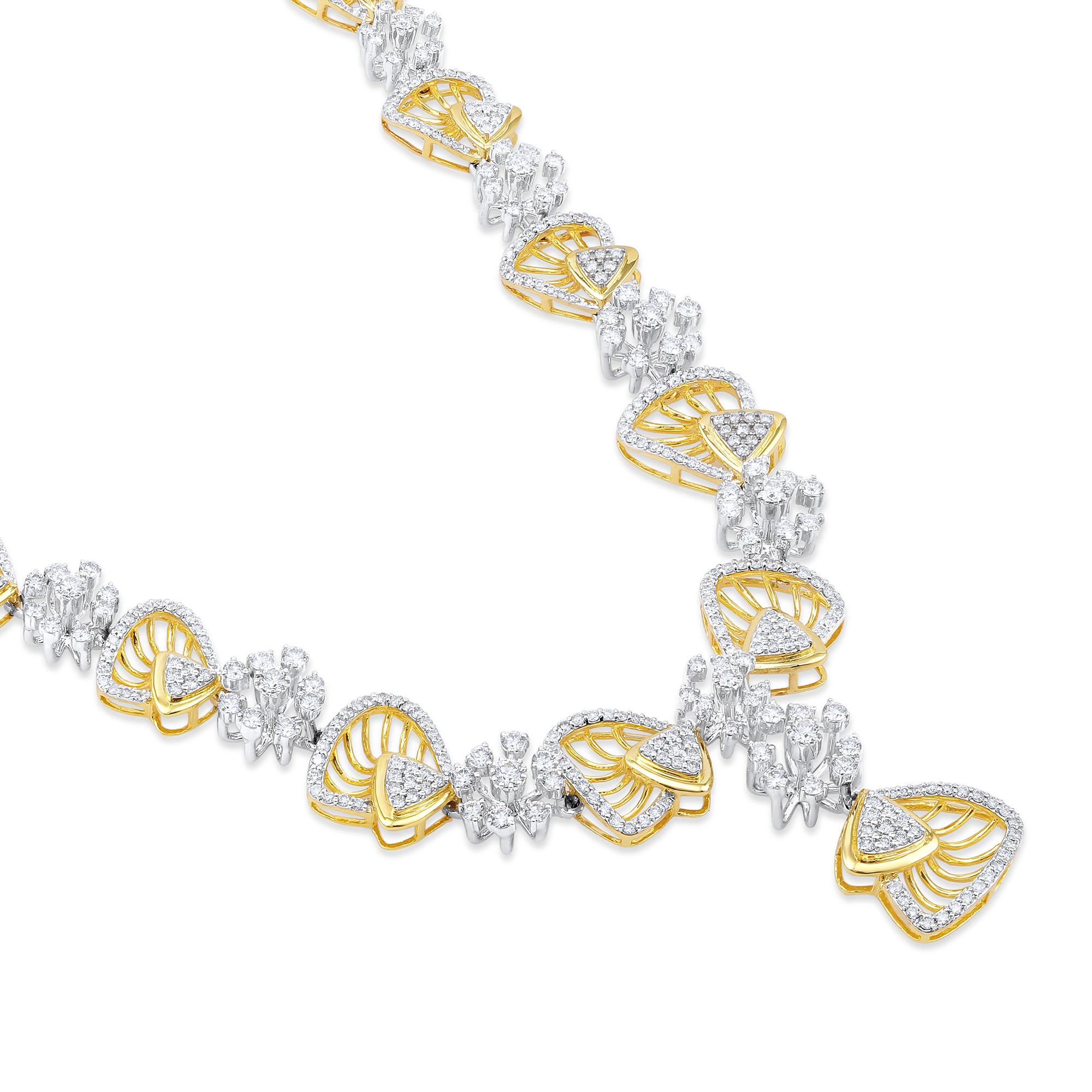 Crafted in 41.75 grams of 14-karat Yellow Gold, contains 544 Stones of Round Diamonds with a total of 5.14-Carats in G-H Color and VS Clarity. The Necklace is 20-inch in Length.

CONTEMPORARY AND TIMELESS ESSENCE: Crafted in 14-karat/18-karat with