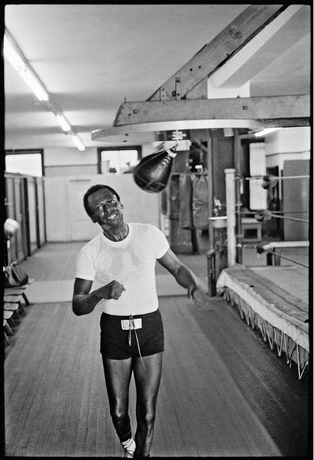Signed limited edition print of Miles Davis boxing at Gleason’s Gym in 1970 by photographer Glen Craig.

Miles Davis works out with a speed bag at Gleason’s Gym in the Bronx. “He was fascinated by boxing, and he was good at it,” Glen Craig says.