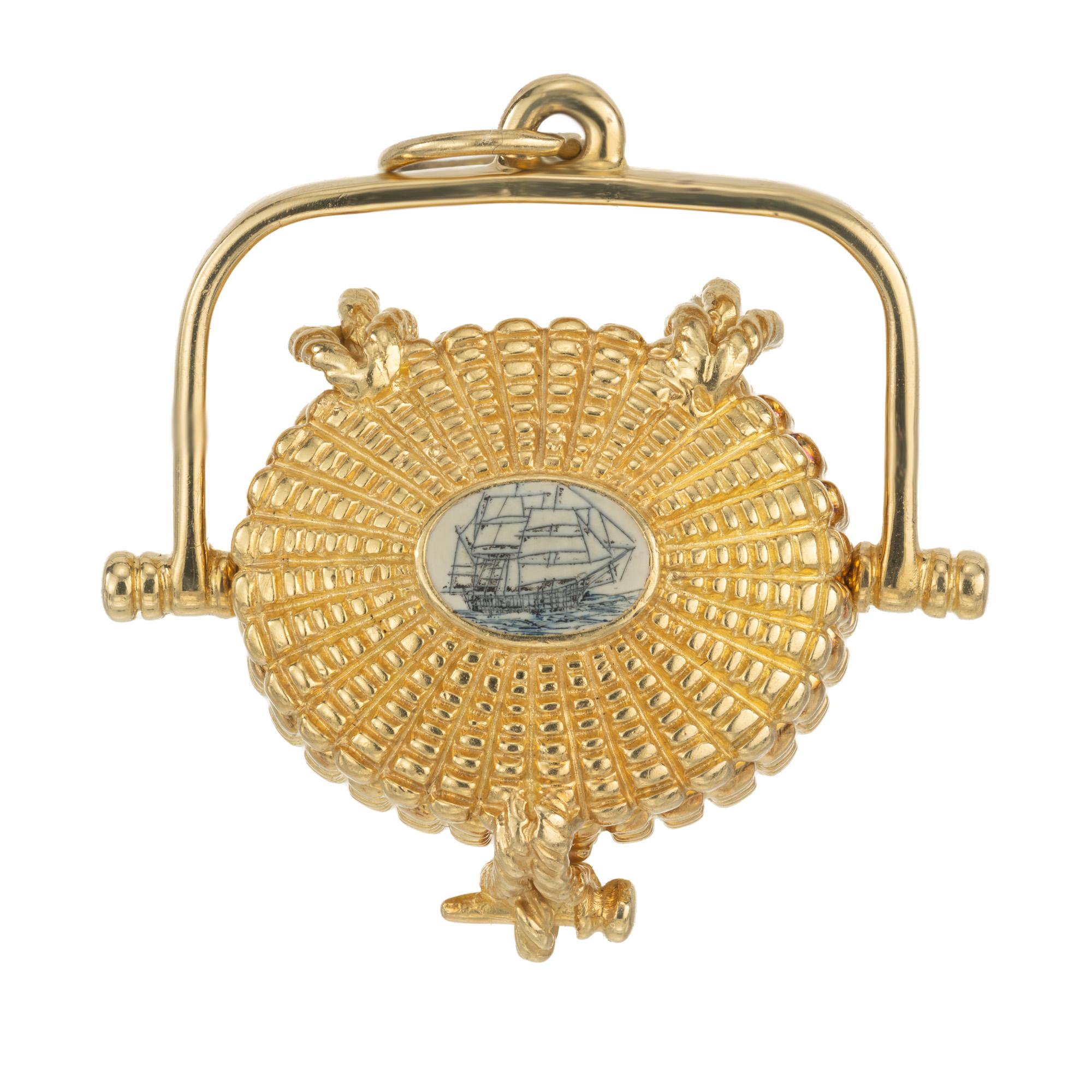 Glenaan Elliott Robbins designed the first Nantucket picnic basket in 1977 for her store on Straight Wharf. Crafted in 18k yellow gold, the beautifully detailed oval shaped basket has a movable handle and a lid that opens to reveal a miniature penny