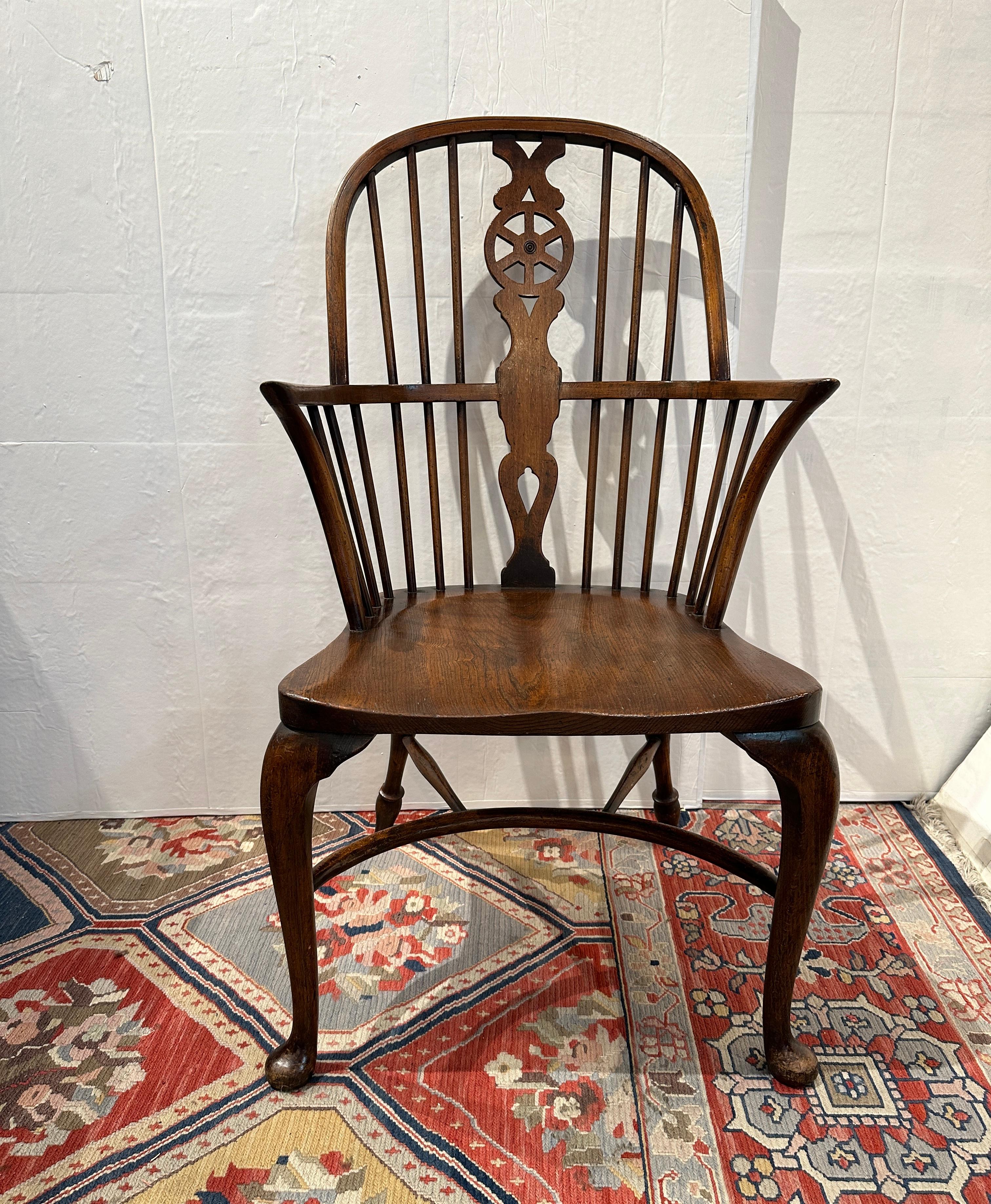 Early 20th Century, Set of 4 Windsor Arm chairs.  Marked underside Wicombe Glenister England.  Wheel back, Elm seat and oak wood.  All In sturdy excellent condition.  Beautiful Windsor chairs.
