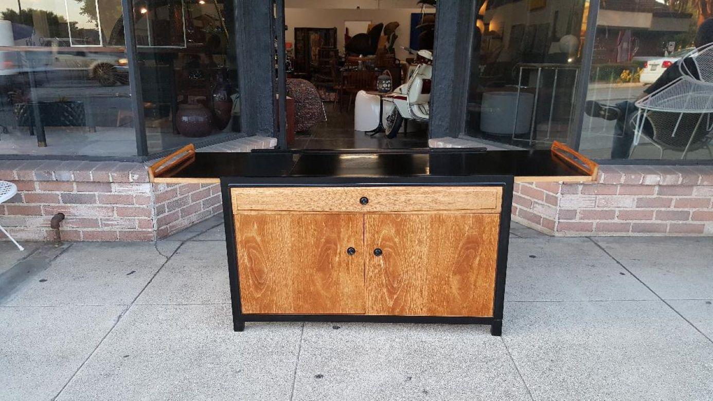 Glenn of California Extendable and drop leaf walnut and Black Lacquer Cabinet Or Bar Designed by John Kapel 1965.

Glenn Of California Walnut and Black Lacquer Cabinet Can Be Used As A Credenza Or Bar Designed by John Kapel 1965.

A Beautiful
