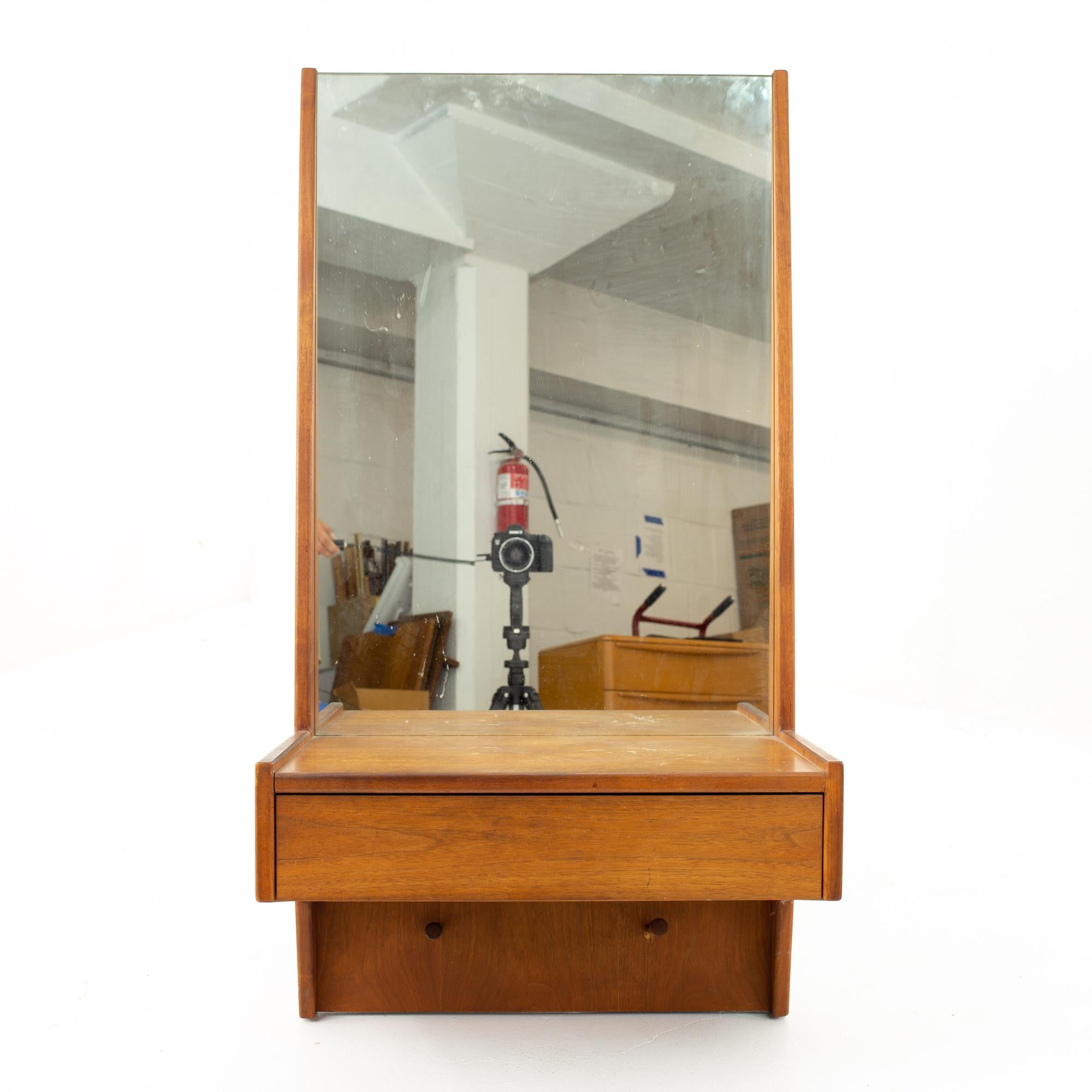 Glenn of California midcentury walnut entry mirror

Mirror measures: 22 wide x 13.5 deep x 42.5 high

This price includes getting this piece in what we call restored vintage condition. That means the piece is permanently fixed upon purchase so