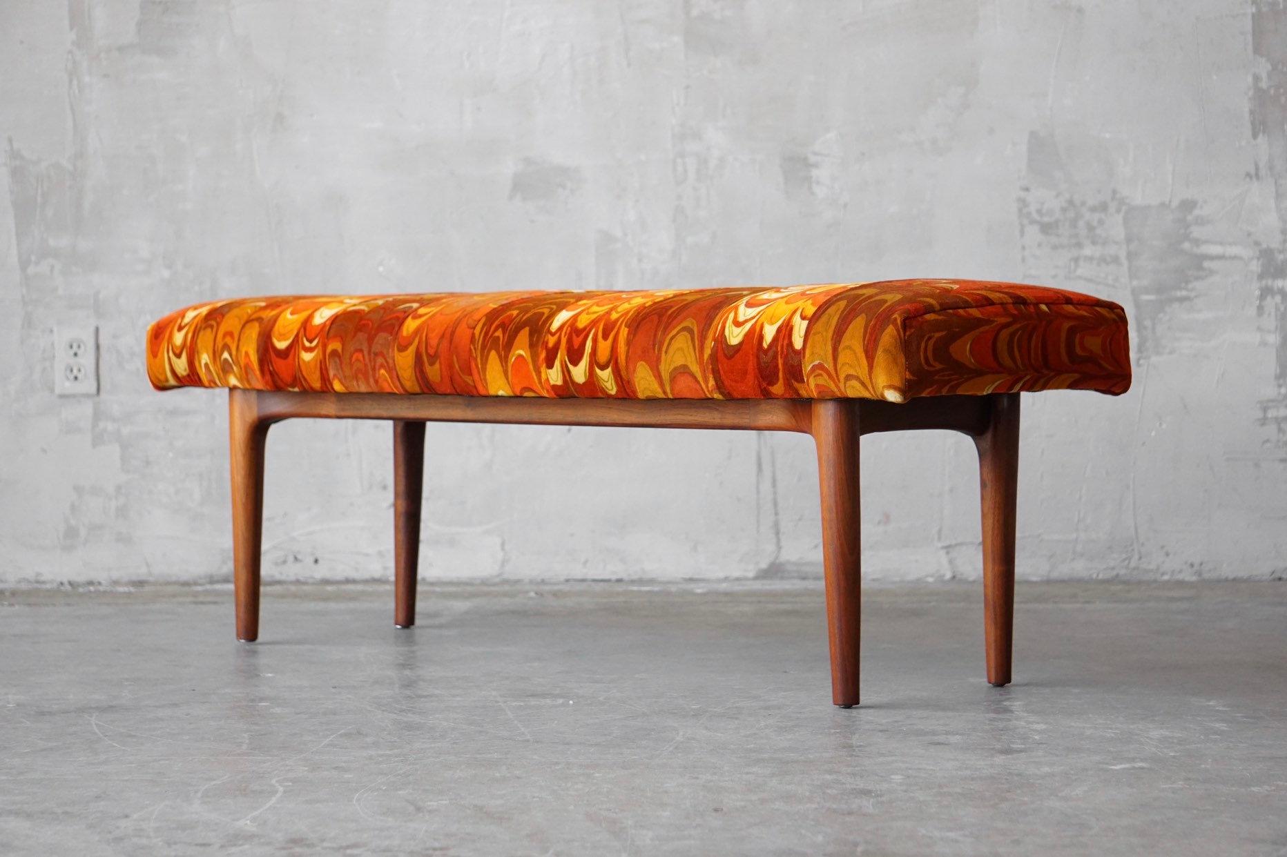 Well designed bench by Glenn of California, circa 1950s. Constructed with a sculpted walnut base and upholstered in Jack Lenor Larsen ‘Aurora’ velvet fabric. 

Measures 51