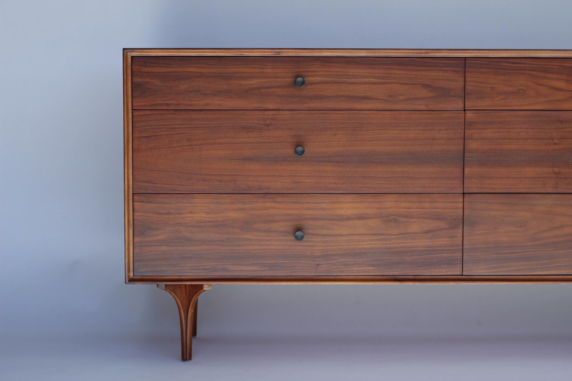 Walnut dresser routinely attributed to Robert Baron aka Craig Nealy for Glenn of California however this piece has original label by Greta Grossman. This dresser was acquired from original owner in Palm Springs along with another identical dresser