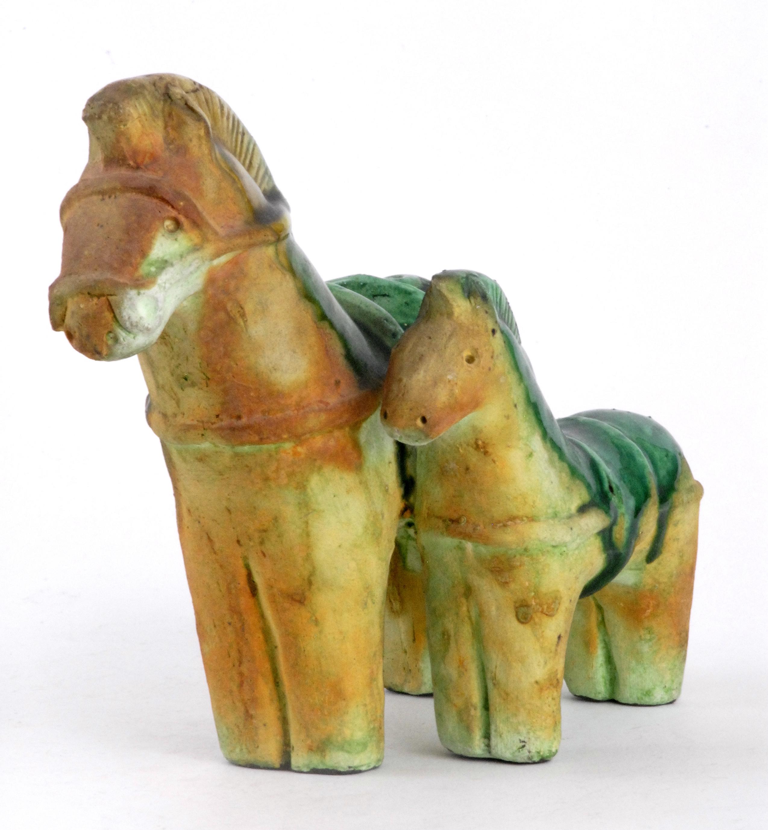 A very good double horse sculpture with shiny green glazed saddles and typical matt glaze finished lower sections and head and front. Unmarked.