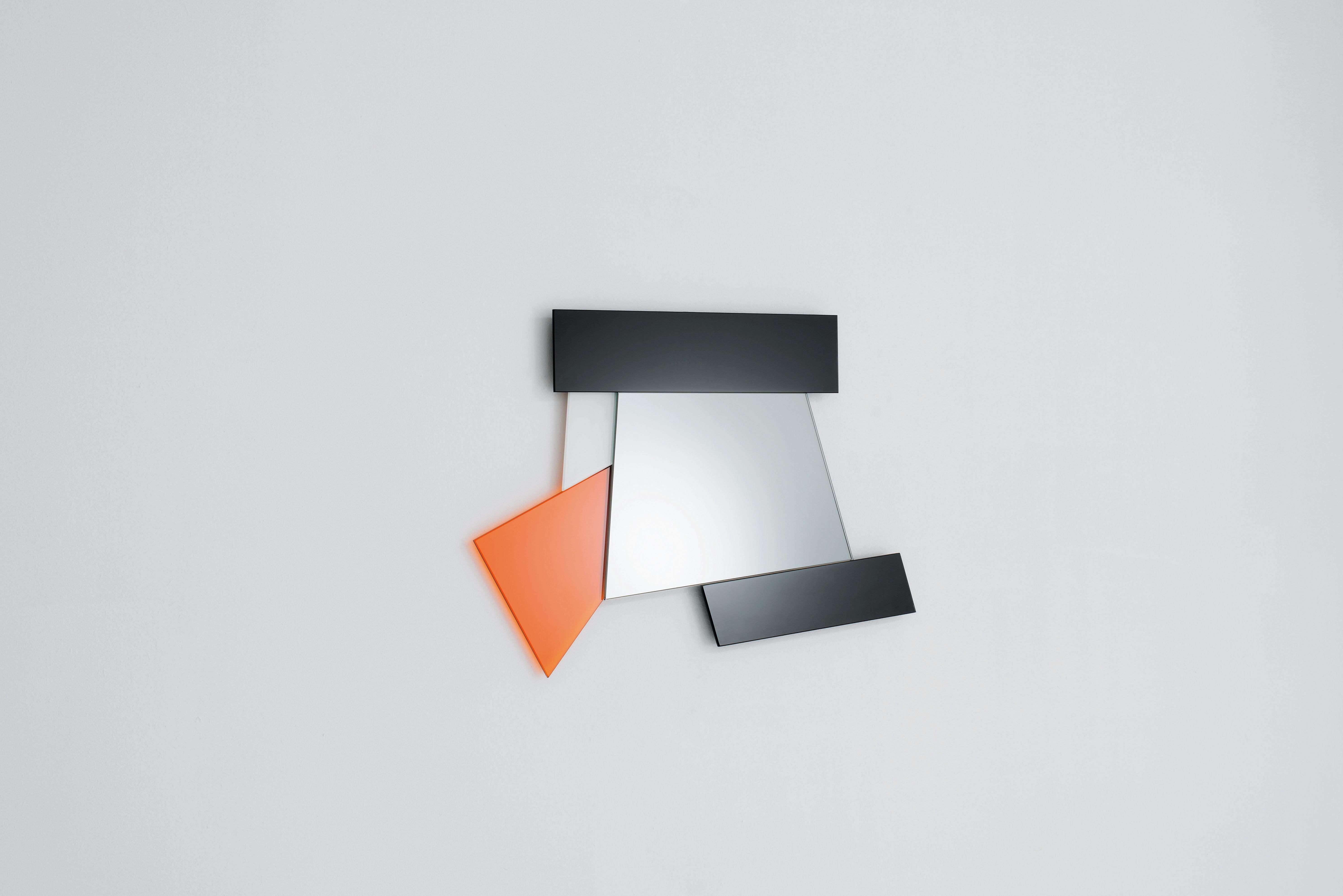 Dioniso4 Gli Specchi di Dioniso wall mirror is from a collection of 6 wall mirrors in different shapes and sizes characterizes by polychromatic frames composed of elements in laminated colored mirror, colored laminated glass and lacquered