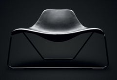 Glide - Armchair in black leather by Monica Forster for Tacchini