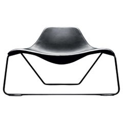 Glide – Armchair in black leather by Monica Forster for Tacchini