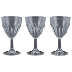 Glimma, Sweden. Three red wine glasses in crystal, faceted bowl and stem.
