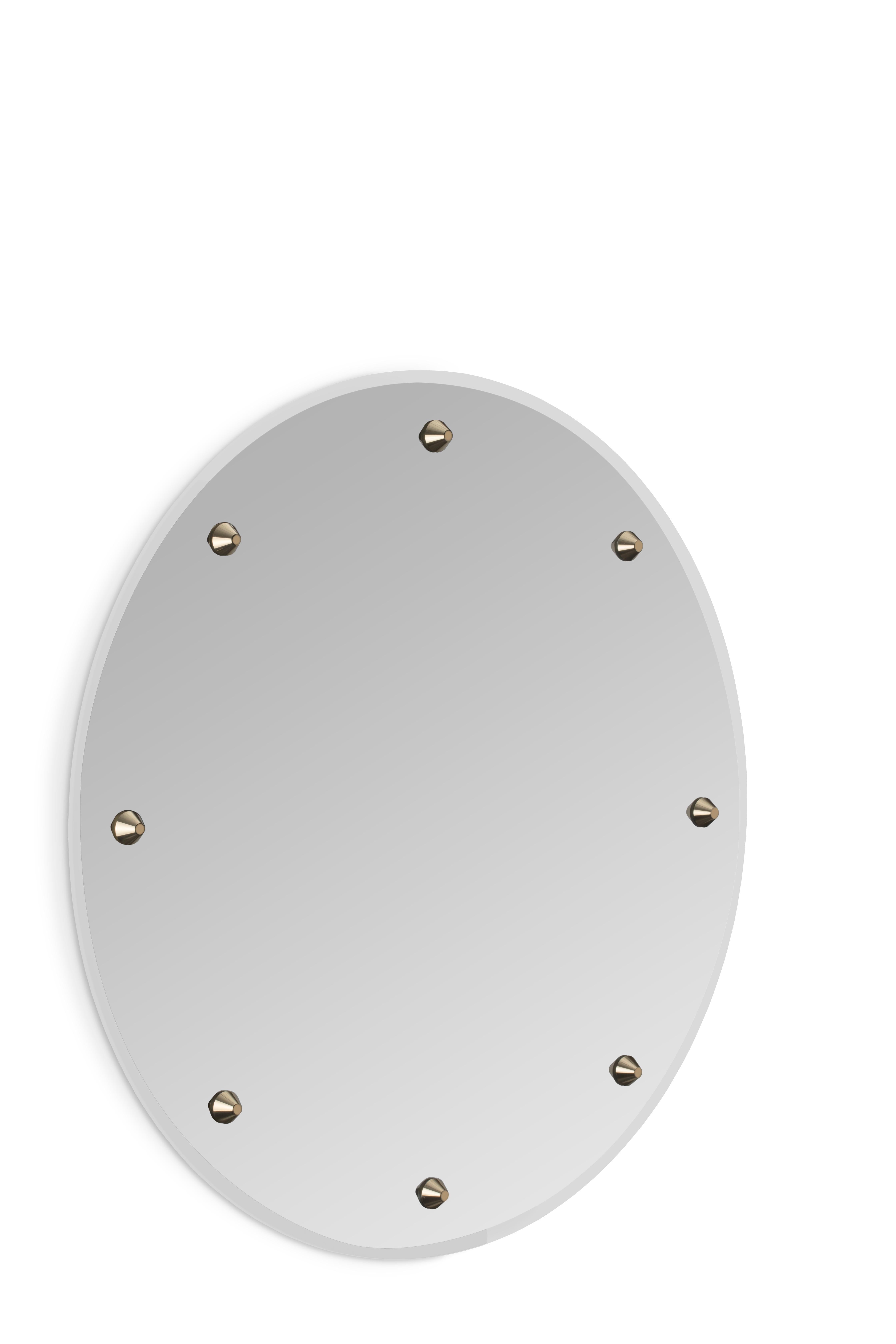 Glimmer mirror, as its name states, adds to your project a faint and elegant light. Glimmer Mirror's subtle lines and crystal details are the result of a precise handcrafted process. A precious piece of art with eight brass details adorned with