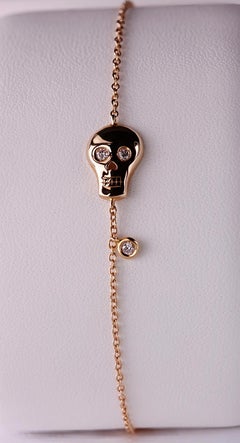 Glimmering Gaze: Rose 18kt Gold Skull Bracelet with Diamond Eyes