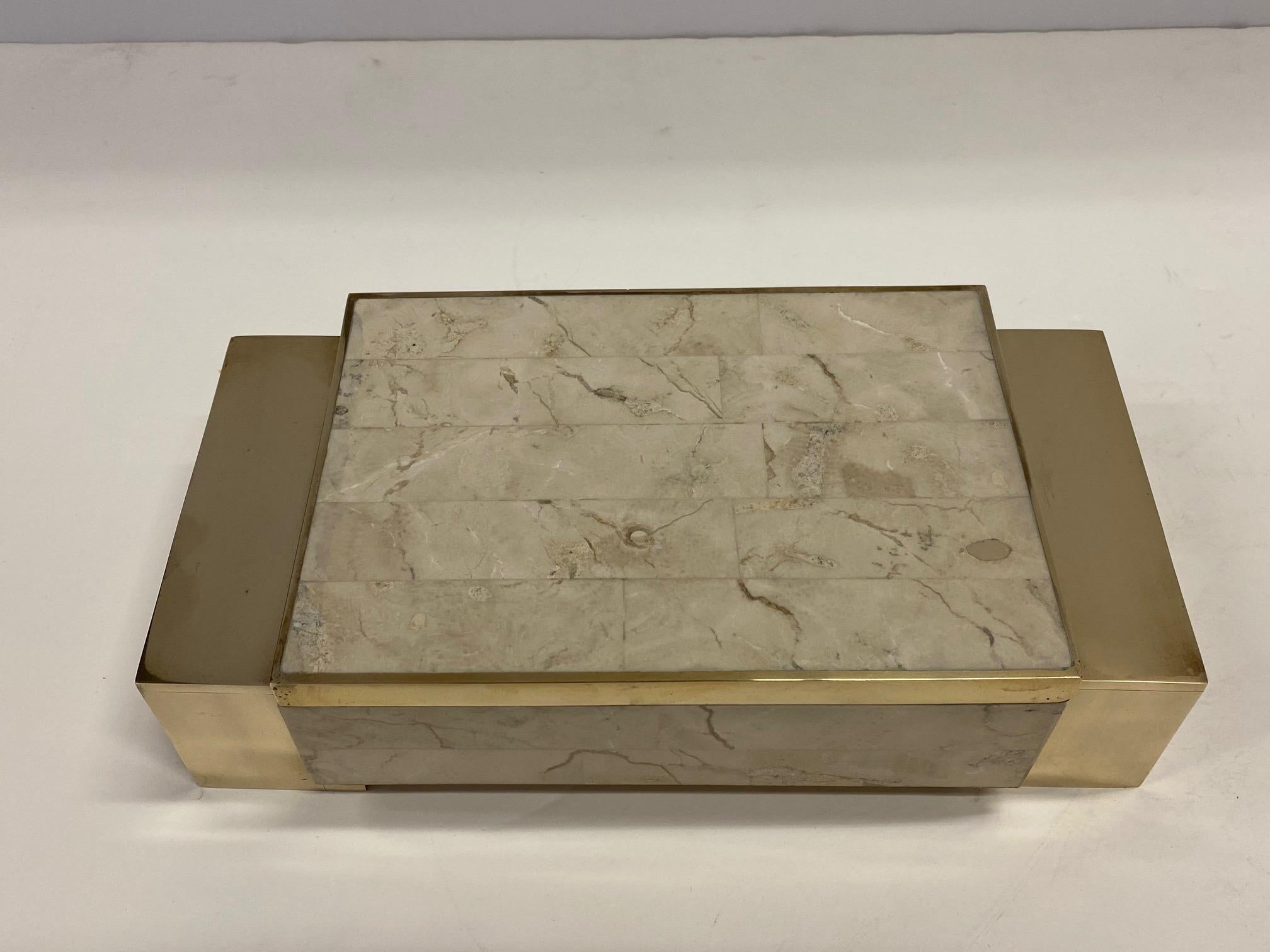 A beautiful cream tessellated stone and brass decorative box with super stylish geometric design.