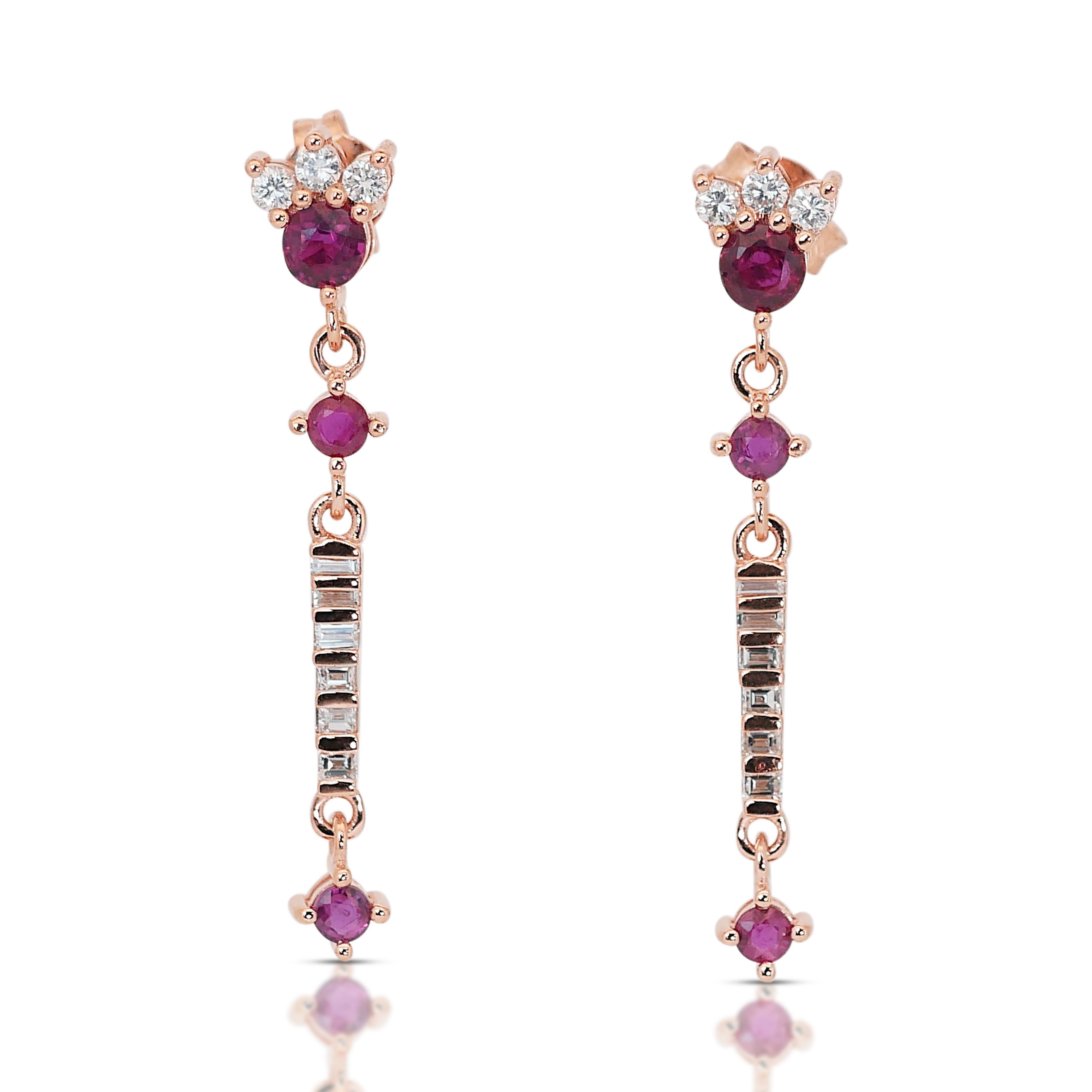 Glittering 14k Rose Gold Rubies and Diamonds Drop Earrings w/1.20 ct - IGI Certified

This glittering drop earrings, crafted in luxurious 14k rose gold, boasts a vibrant display of gemstones. The centerpiece features six round rubies totaling 0.80