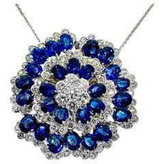 Glittering 18k White Gold Camellia Flower set with Diamonds and Blue Sapphires
