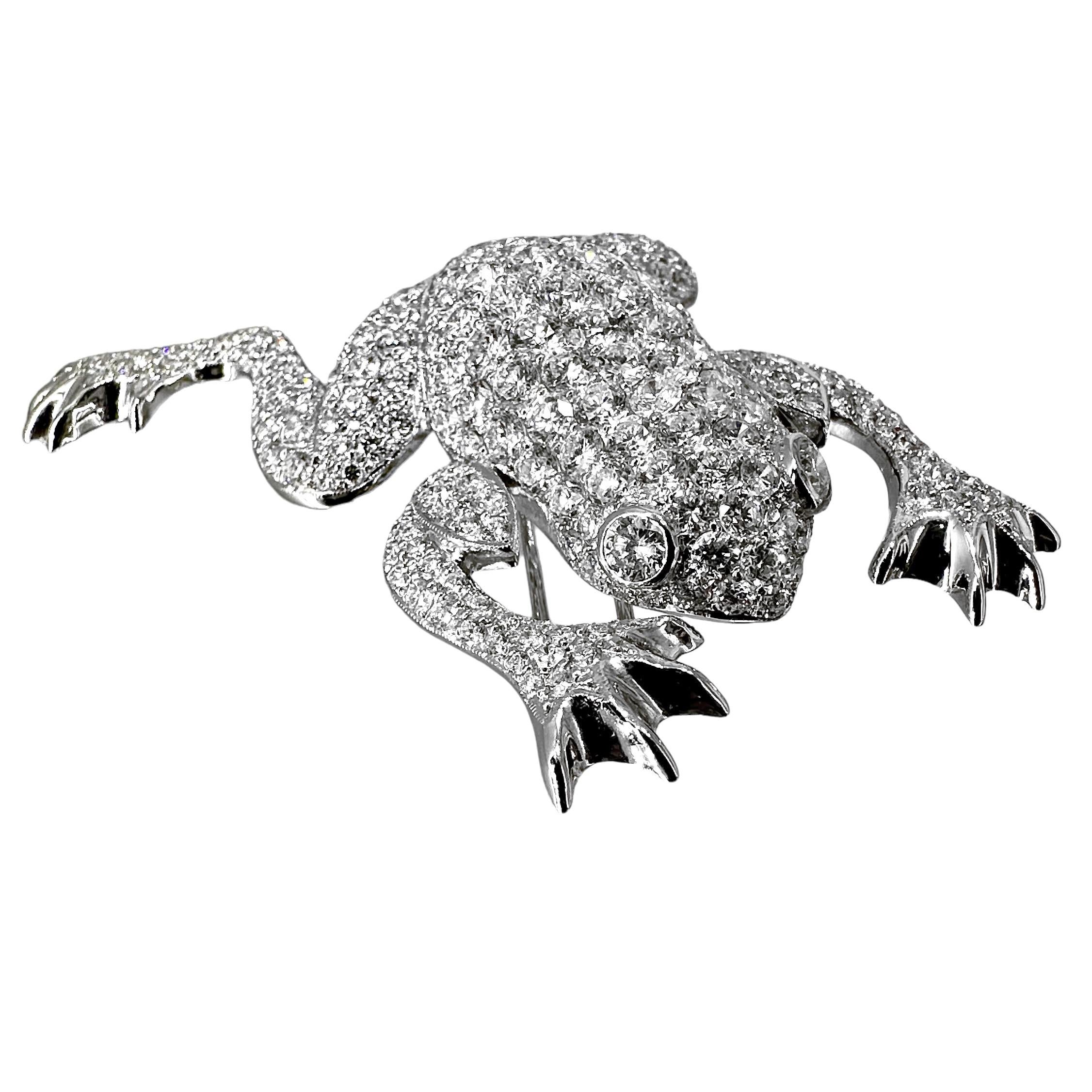 Crafted deftly from 18k white gold and high quality round brilliant cut diamonds, this outstanding brooch is beauty and drama personified. From front to rear it measures 2 1/4 inches and has a width of 1 3/4 inches. Set with a total approximate