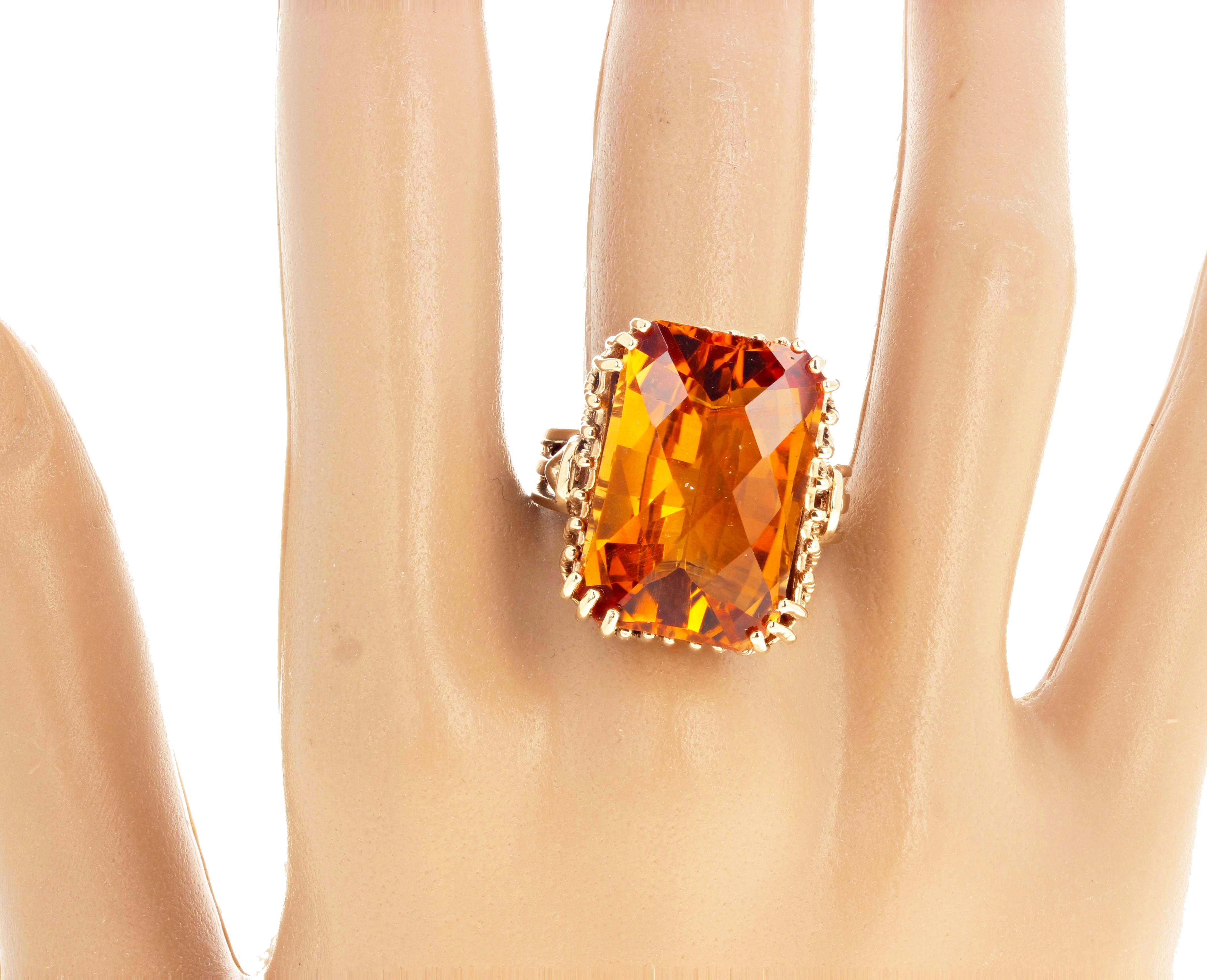Magnificent checkerboard gem cut glittering natural goldy Citrine set in a 10Kt yellow gold ring size 9 (sizable for free).  It measures 21 mm x 14 mm and is a lovely 16.86 carat cushion cut .   If you wish faster delivery on your purchase choose