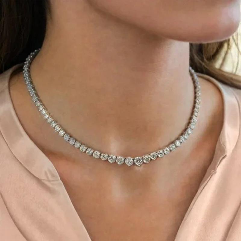 Crafted in 18K white gold, this stunning necklace features 30ct of natural diamonds with FG color and VS clarity, ensuring unmatched brilliance. At 18 inches in length, it’s a timeless piece of elegance, complemented by additional G color SI clarity